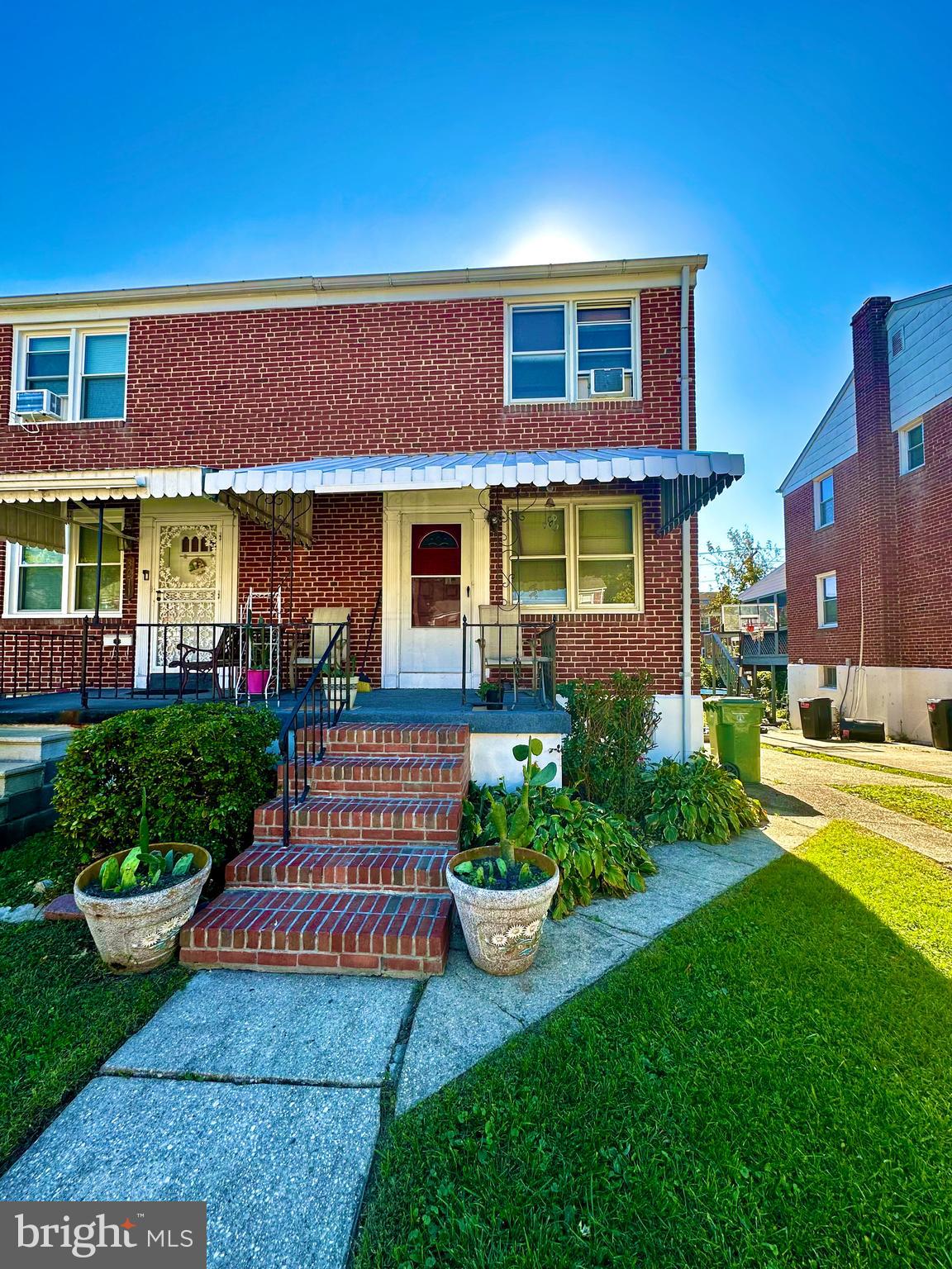 This charming three-level brick townhome has undergone meticulous maintenance and boasts a fresh coat of paint. Upon entering through the covered front porch, you'll appreciate the beautiful new LVP flooring in the main level family, dining rooms, and kitchen. A rear door off the kitchen provides seamless access to the recently refinished deck and fenced-in backyard. The upper level features two spacious bedrooms, which can be easily converted back to a three-bedroom layout, and a full bath. Ample parking is available in the driveway alongside the home. A secondary door from the driveway offers convenient additional access to the fully finished club room basement, complete with new flooring, a half bathroom, and utility room with washer and dryer. Recent upgrades include a new roof and awning. This property is move-in ready, showcasing pride of ownership throughout, and offers buyers the opportunity to update the kitchen and bathrooms according to their vision.