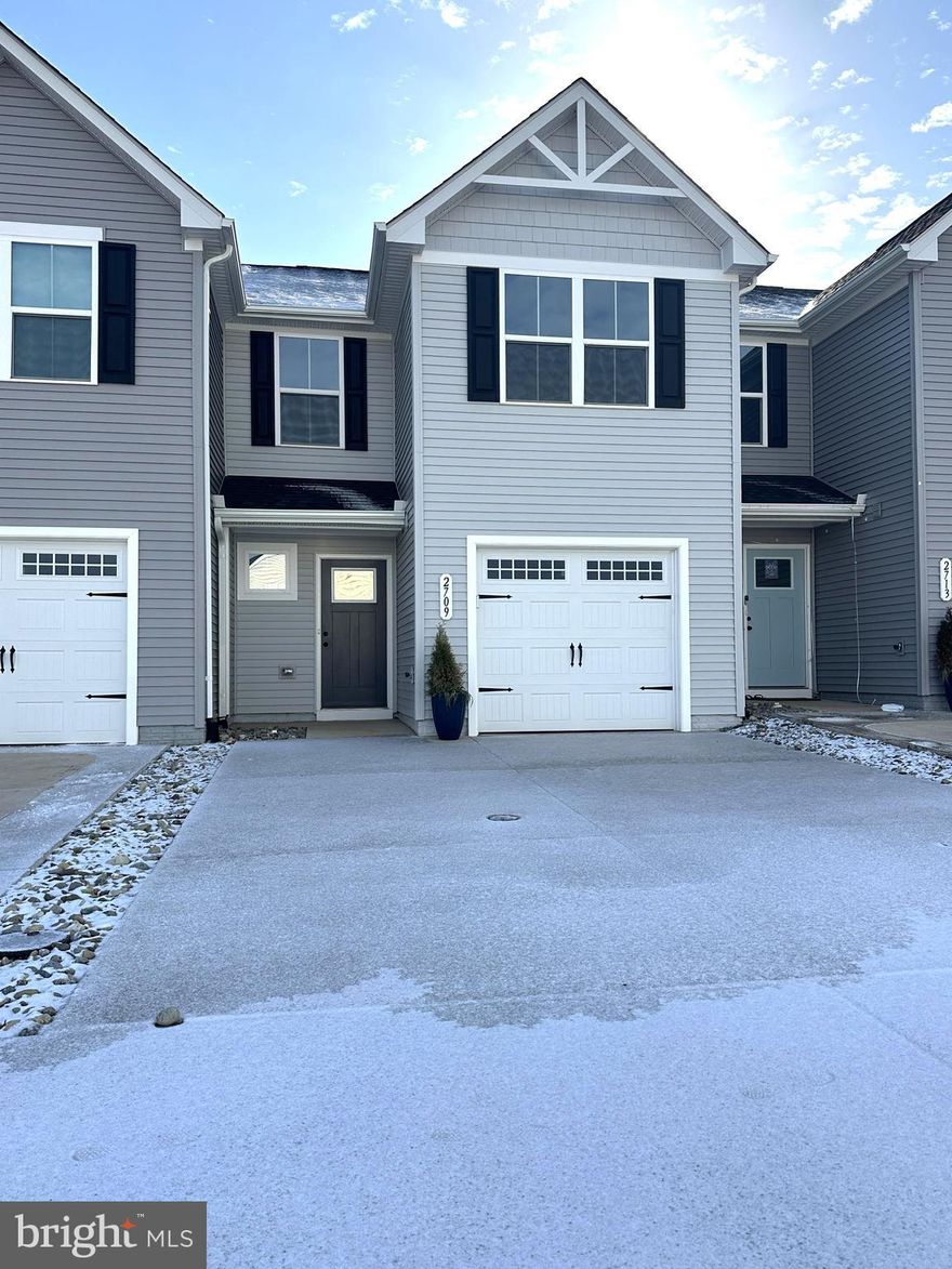 Be the first to call this Laurel Park townhouse home!  Beautiful finishes throughout this two-story, 3 BR/2.5 BA home, with a one-car garage.  Upgraded flooring and countertops, and great storage space.  Gourmet kitchen w/ center island and breakfast bar, and a huge pantry!  Sliding glass door to the rear yard space.  Half bath on the main level, and two full baths on the upper level.  Additional parking along the street and in the parking area just a few units down. No smoking. No pets.