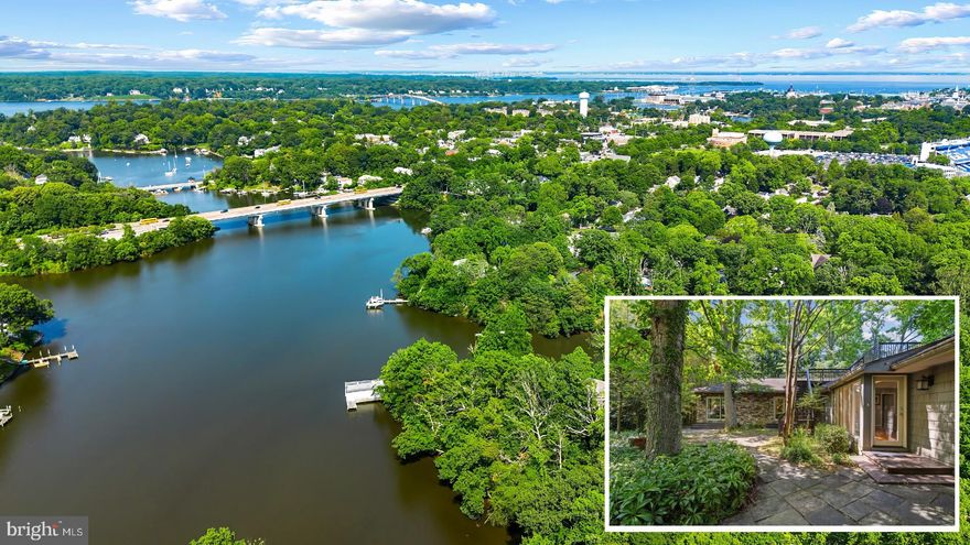 Extraordinary mid-century modern waterfront home in coveted Admiral Heights community walkable to everything Annapolis has to offer. This special residence offers the perfect elevation to behold the vast views of Weems Creek; a wonderful sanctuary for boaters, waterfowl and wildlife. Enjoy watching the ever changing scenery from almost every room or from the expansive rear deck and lower level patio; both are ideal for entertaining or relaxing all year long. The well appointed interior boasts painted wood vaulted ceilings, exposed beams and beautiful hardwood floors throughout the main living area. The gourmet Kitchen flows into the spacious Dining area and into the Living room with the floor to ceiling fireplace as the focal point. A cozy place to gather on a cool winter night! The walls of windows frame the beautiful water views and the office nook with adjacent full bath offer a variety of options for use. The Primary bedroom suite exudes a true sense of peace and serenity with the panoramic water views, and an ensuite bath featuring double sinks, jetted tub, huge walk-in shower and enviable custom closet. The 2 additional spacious bedrooms with shared bath offer opportunities for housing a large family or multiple guests. Head down the stairs to the lower level walkout with walls of glass to enjoy the oversized Family room and bonus area with full bath that is perfect for a bedroom, home office, or gym. The roof deck provides a treetop view of the creek. Enjoy sunrises, sunsets and the serene surrounding scenery. The Admiral Heights community boasts a community pool, community pier and water privileges. Located within close proximity to restaurants, groceries, shopping and Navy Stadium events, with easy access to all major commuter routes to DC, Baltimore and beyond. Welcome Home!