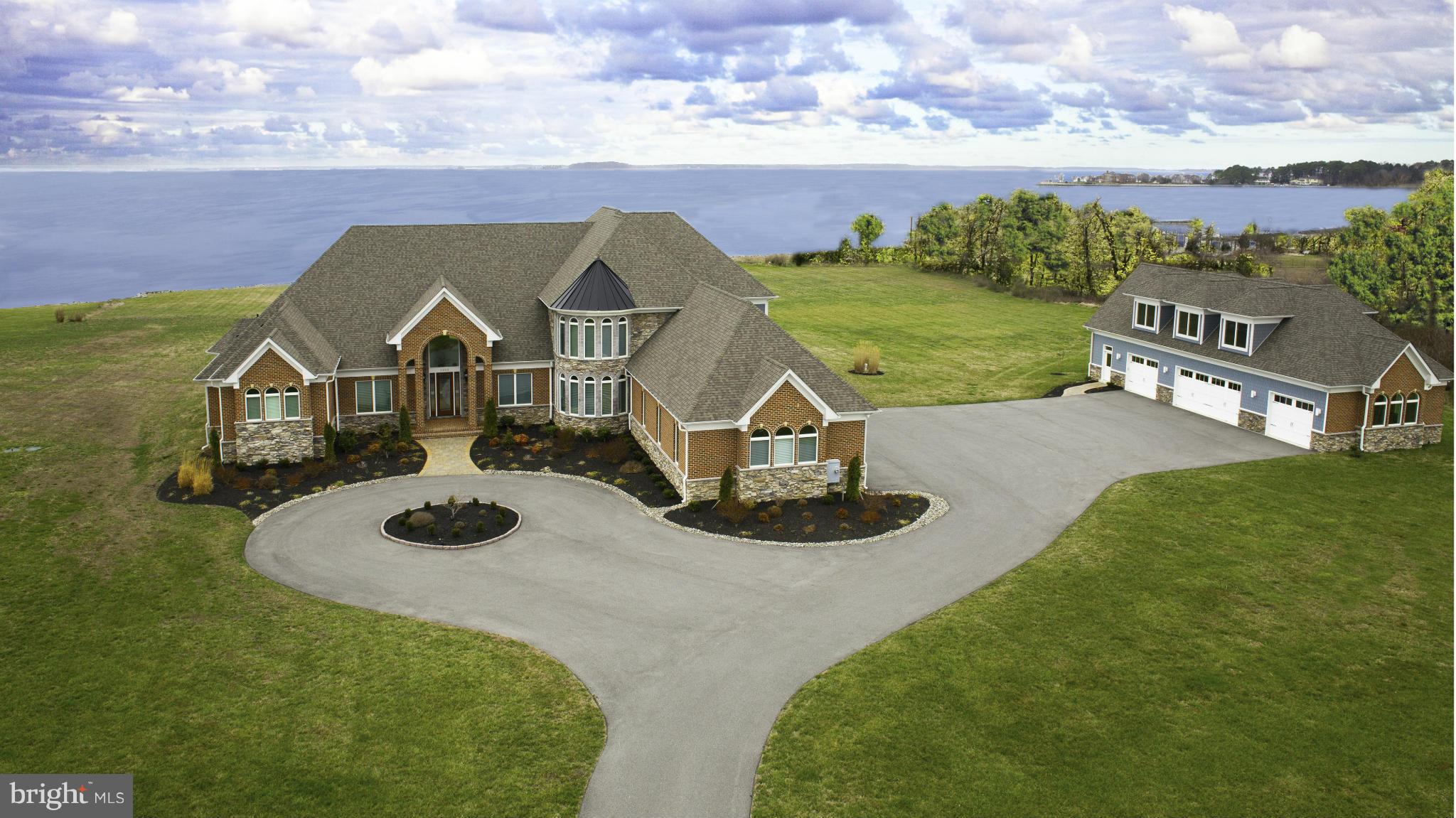 Every inch of this entertainer's haven and waterfront paradise is detailed with lavish amenities, SMART HOME FEATURES, extras, & quality that go beyond every expectation. Custom blt and only 5 years young, dramatic portico, and 8 garage bays. Inside the main residence, features incl.Geothermal HVAC , Gour Kitch, Hdwds, 2 Studys, Lux Mstr Ste w/ Steam Shower & Spectacular Bay view Sunsets!