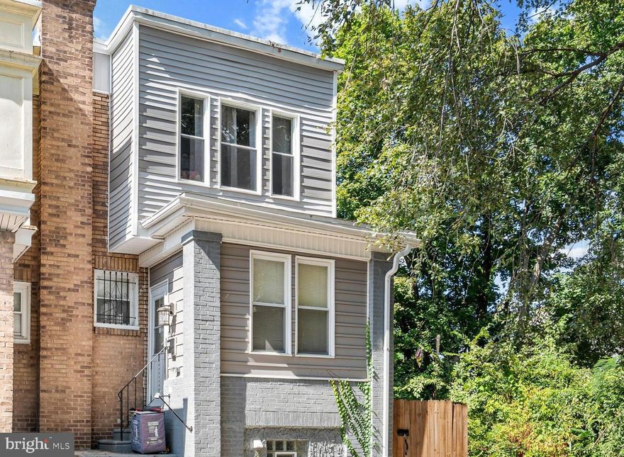 Welcome to this beautifully renovated end-unit row home, perfectly situated in NW Philadelphia. This 4-bedroom, 2-full-bathroom property is the epitome of modern living and is waiting for you to call it home.
Upon entry, you’ll be greeted by a large foyer featuring an oversized mirrored coat closet, perfect for last-minute touch-ups before heading out. From the foyer, step into the open-concept main level, which flows seamlessly from the spacious living room to the dining area and kitchen.

The brand-new flooring throughout enhances the sleek, modern design, while the fully updated kitchen boasts granite countertops, a breakfast bar with seating for five, and custom cabinetry. The stainless steel appliances add a contemporary touch, making the space perfect for entertaining or casual family meals. 

The kitchen opens directly onto a deck/balcony, ideal for outdoor dining, grilling, or simply relaxing.
Upstairs, you’ll find three generously sized bedrooms, each with ample closet space, as well as a modern hall bath. The abundant natural light pours through the new windows, which have been installed throughout the home to provide a bright and airy atmosphere.

The lower level offers a private retreat with an additional bedroom, a luxurious spa-like full bathroom, and a separate laundry area. With its private entrance, this level is perfect for a rental unit, such as Airbnb or Vrbo, or an additional living space for extended family or guests. It also features two oversized closets, offering plenty of storage options.

This home is equipped with brand-new central air and heating systems, a new water heater, and fully updated plumbing and electrical systems — all upgraded in 2022 for optimal efficiency and comfort.
Outside, the newly fenced-in side yard offers a spacious area for outdoor activities and includes a convenient storage shed.

This home offers the best of both worlds: modern, high-end living with the convenience of city life. Don’t miss the opportunity to own this beautifully updated property! Be sure to ask the listing agent how you may qualify for up to $22,000 in down payment assistance to help with closing costs.