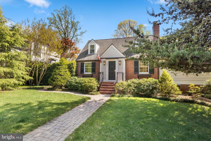 Welcome to 5624 Madison Street, nestled peacefully on one of the quiet, tree-lined "President Streets" of Huntington Terrace. Offering the perfect blend of classic 1940s character and well-executed modern expansions, this residence is a rare find in one of Bethesda’s most walkable and sought-after neighborhoods. With five bedrooms and four-and-one-half baths, this Cape Cod-style home is full of pleasant surprises!

The home greets you with a formal living room featuring refinished hardwood floors and a traditional fireplace. Beyond the living room is a formal dining room—intimate enough for family dinners, yet spacious enough for gracious dinner parties. The updated kitchen features stainless appliances and a cozy breakfast nook.

The floor plan flows seamlessly into a stunning, vaulted-ceiling family room addition and an enclosed porch. With large Andersen windows and French doors framing views of the gardens, it is the perfect private spot to enjoy your morning coffee while taking in the spring flowers and lush landscape.

This home boasts many unique features, but the guest suite is a fan favorite! This thoughtful addition blends seamlessly with the original architecture and provides a large bedroom and full bath. With vaulted ceilings, an abundance of natural light, and a bird’s-eye view of the gardens from every window, it is a truly special retreat.

The addition also includes a tiled sunroom overlooking the garden. This space is ideal for a sitting room, private home office, or playroom, and it connects the home to the oversized garage. The garage provides ample space for a vehicle plus a workbench, gardening tools, and sports equipment. A paver driveway extends gracefully to the street.

Four bedrooms and three bathrooms are located in the original wing of the home. Upstairs features the primary bedroom with an ensuite bath and generous walk-in closet, plus a second bedroom and hall bathroom—both featuring charming dormer nooks. The lower level includes two bedrooms and one bathroom. These are ideal for use as guest rooms, a quiet home office, or a study. This level also offers the potential for a future larger primary suite with an oversized walk-in closet.

The finished basement includes a laundry area with a washer/dryer and sink, as well as a creative play area featuring synthetic turf and a mounted movie screen! Whether you envision a home gym, a media room, or a hobby space, the choice is yours. A powder room and storage area complete this level.

Step outside into a masterfully landscaped garden. The backyard features a patio nestled under a canopy of trees and surrounded by privacy hedges. A walking path leads through a wrought iron gate to the front yard, while another path provides access behind the garage. The yard comes alive in spring, blooming with daffodils, hyacinths, and rhododendrons. These gardens were designed for year-round beauty and privacy—a true reflection of the loving care the owners have given this home.

Located in the heart of the "President Streets," you are just minutes from the Medical Center Metro, NIH, and Walter Reed. Enjoy the convenience of walking to the shops and dining of Woodmont Triangle while residing in a peaceful community known for its friendly atmosphere and top-tier school district. Welcome home!