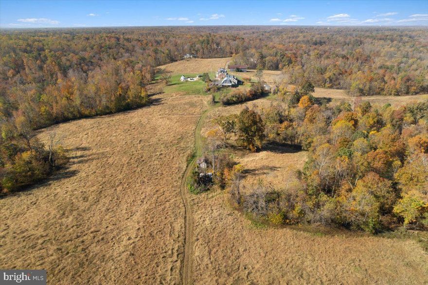 ORIGINAL CANOE NECK FARM FOR SALE! 329.5 Acres in RPD zoning -- 2 existing homes; SQFT/beds/baths are approx. totals for both homes -- Larger home is Georgian colonial, smaller home is southern-style Cape Cod -- Multiple barns/outbuildings in varying conditions -- Massive detached 6 car garage in good condition; additional 4 car garage attached to smaller home -- No easements or preservation -- Communications tower lease available for review -- Partially cleared/partially wooded land -- Has functioned as a working farm as recently as 2021 but is not currently in use as a farm -- Both of the homes on the property are in need of a moderate rehab prior to occupying but are in stable condition and are not in need of a total gut and restore; many impressive/salvageable features in both properties -- Each home has its own well/septic system -- Pool/pool house in need of repair -- Incredible wildlife/nature; private oasis for hunting, hiking, camping. -- Future potential uses; private residential compound, vineyard/winery, minor subdivision, hunt club, solar farm, organic farm, D.C. restaurant supply farm, horse farm, mineral resource extraction, timber sales, retreat center, bed and breakfast -- Quick close available; 1031's welcome -- Owner financing available w/ appropriate terms -- Additional images/video available upon request; images in listing may be edited/enhanced to show potential uses -- All land uses must be approved by appropriate governing bodies in accordance with planning/zoning laws; buyers to complete due diligence, seller/listing agent make no claims/guarantees.