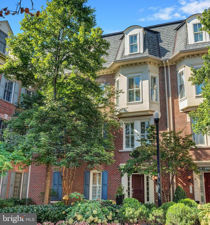 Experience unparalleled luxury in this distinguished four-bedroom townhome, the largest model in the community. Expertly designed and beautifully maintained, the home is surrounded by professionally landscaped gardens, offering both beauty and privacy. The residence boasts three gas fireplaces and exquisite hardwood flooring throughout the entry level, main living areas, and the owner’s suite, creating an ambiance of elegance and warmth. A thoughtfully placed bathroom on each level enhances convenience and functionality.

The open floor plan is flooded with natural light, emphasizing the home’s sense of spaciousness and sophistication. Stylish, modern lighting fixtures with matte black finishes, along with newly updated hardware, outlets, and switches, enhance the home's contemporary appeal. The kitchen, renovated in 2021, is a culinary masterpiece. It features premium stainless steel appliances, including a Bosch dishwasher, wall oven, convertible microwave, and a five-burner gas cooktop. A sleek XO stainless steel hood, Kraus sink with a protective grid liner and pull-down faucet, and an LG French door refrigerator with a convertible drawer and glass panel door add to the home's modern luxury. A pristine white subway tile backsplash, hidden trash drawer, and a central kitchen island with a breakfast bar complete this chef’s haven. The adjacent family room, connected by a double-sided gas fireplace, flows seamlessly into the dining room, which is framed by a bay window and accented with a sophisticated chandelier.

On the upper level, the impressive owner’s suite offers a serene retreat, featuring hardwood floors, a bay window overlooking a lush courtyard, a custom walk-in closet with double-entry doors, and a gas fireplace for added comfort. The luxurious ensuite bath features a soaking tub, a freestanding shower with a frameless glass door, elegant fixtures, a private water closet, and a towel warmer, creating a spa-like experience. Two additional bedrooms are also located on this level. One of these bedrooms features a magical hand-painted mural, adding a unique and enchanting touch to the space. This level also includes a full bath and a convenient laundry room equipped with new front-loading washer and dryer (2021), a butcher block folding station, custom shelving, and a drying rack.

The top floor reveals a striking loft space, ideal for a home office or additional living area. This level also includes a fourth bedroom with a walk-in closet and access to the private rooftop terrace. The terrace is equipped with a gas connection and water spigot, making it perfect for outdoor dining, gardening, or relaxation. A sleek utility sink off the loft area provides practicality for projects or plant care.

Situated in the highly sought-after Potomac Greens community, this home is ideally positioned near Amazon HQ2, the Virginia Tech Innovation Campus, and the Potomac Yard Metro station. The community offers an array of premium amenities, including scenic nature trails, brick-paved sidewalks, a charming clubhouse with a meeting and party room, a fitness center, a heated outdoor pool, picturesque pocket parks, and tot lots.

Beyond the community, the home’s location is unrivaled. Just minutes from Old Town Alexandria’s historic waterfront and the vibrant Del Ray neighborhood, this property also provides easy access to outdoor activities with the nearby George Washington Parkway and the renowned Mount Vernon bike trail. With quick connectivity to I-495, I-395, and I-95, and only two traffic lights from downtown Washington, D.C., and Reagan National Airport, this home ensures effortless commuting and travel.

Don’t miss this rare opportunity to own an extraordinary townhome in the prestigious Potomac Greens community. Here, modern luxury meets timeless elegance, offering a lifestyle of comfort, convenience, and sophistication.