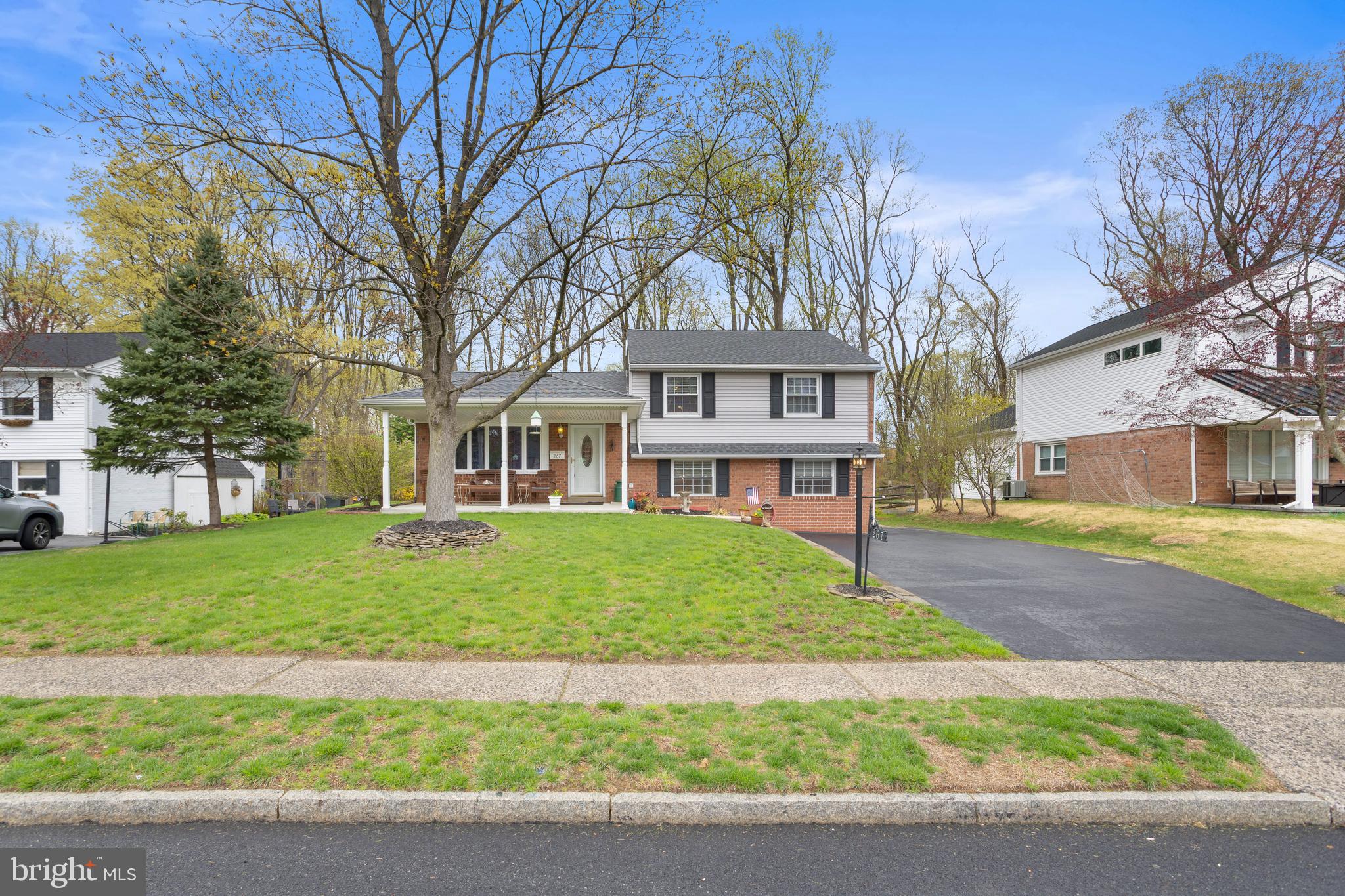 Located in sought-after Springfield, just steps from trails and parks, this spacious split-level colonial offers a flexible layout, modern updates, and a private backyard that borders 29 acres of preserved woodland. The main level features a large living room with hardwood floors, a dedicated dining area, and an updated kitchen with a large enough peninsulas to seat six- perfect for casual meals or entertaining. Downstairs, you’ll find a large family room, mud/laundry area w/exterior exit, powder room and a ground-floor bedroom—ideal for guests, a home office, or playroom. Upstairs, you'll find three more bedrooms and a full bathroom. A covered front porch and flat backyard provide space to relax or entertain with nature as your backdrop. UPDATES: Main roof replaced (2023), New rubber roof (2024), Sewer line replaced (2019), HVAC & Hot Water (2018), Hardwood flooring (2017), Kitchen & Appliances (2017) & more! BONUS: Direct access to Springfield’s wildlife park, hiking trail, and Whiskey Run Creek right behind the home. Enjoy a quiet, family-friendly neighborhood in the home of National Blue Ribbon-winning Springfield High School, just minutes from Springfield Country Club, Saxer Ave shops, the trolley to Media, and top-rated local restaurants.