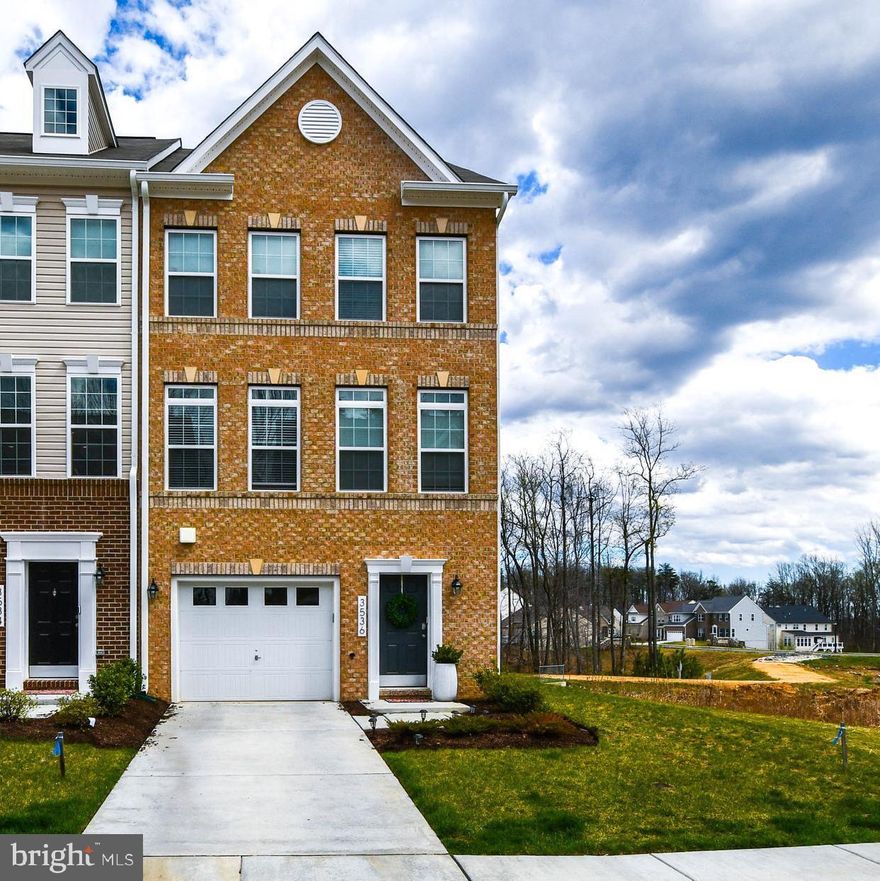 WELCOME HOME!! This beauty is 1 year old and is nestled in the heart of Upper Marlboro.  Owner has lovingly maintained his home!  End unit with front and side brick.  Hardwood flooring on the 1st and 2nd floors as well as the stairs leading to the 3rd floor.  Step into the large foyer which leads to the walk-out recreation room with a built-in fireplace. You'll love the kitchen with quartz countertops, stainless steel appliances, double oven, backsplash, large island with additional cabinets and a custom pantry. The family room features another gas fireplace.  Large master bedroom with a custom closet .  Master bathroom features a stand alone tub.  2 additional generous size bedrooms, 1 car garage, 2nd floor laundry room, recessed lights, custom blinds, deck and much more! Conveniently located just minutes from the Capital Beltway, 20 minutes to downtown DC, National Harbor with shopping, entertainment, restaurants and much more. This is a must see!