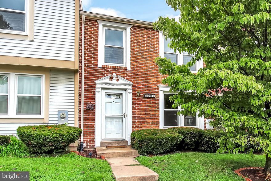 This brick front townhouse has new windows and exterior doors, fresh paint from top to bottom, plus updated bath.  New flooring in kitchen and bath, plus updated laminate on the entire first floor.  Finished lower level with wood burning fireplace.  Rear yard is fenced with a deck off the kitchen.  Bring your furniture and move in!!!