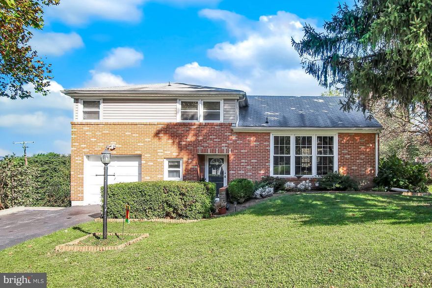 Lovely split level in popular Haines Acres development! This 3 bedroom 1.5 bath home has lots to offer! Large kitchen with breakfast area, lots of cherry cabinets, and access to covered deck with porch swing.  Separate formal dining room, partially finished lower level with walk out to concrete patio. Hardwood flooring under carpet and lots of storage throughout! Call for a showing today!