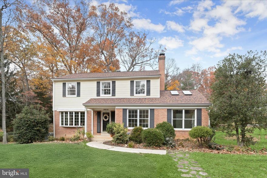 Welcome to this classic Colonial located in the highly sought after Glenelg community, perfectly positioned on a beautifully landscaped corner lot across from Glenelg High School. A charming foyer with hardwood floors introduces the warm and inviting living room enhanced by a bay window. The formal dining room features classic moldings, hardwood flooring, and direct access to the deck ideal for seamless indoor-outdoor entertaining. The eat-in kitchen offers ample cabinetry and a cozy casual dining area, while the adjacent family room is anchored by a welcoming fireplace and luxury vinyl plank flooring. A standout feature of the main level is the spacious addition, offering a versatile sitting room with built-in shelving, soaring vaulted ceilings, skylights, and a walk-in closet perfect for a home office, studio, or lounge. A powder room, laundry room, and walkout access to the rear yard and detached oversized garage complete the main level. Upstairs, the primary bedroom includes hardwood floors and an en-suite full bath. Three additional bedrooms, each also with hardwood flooring, along with a second full bath, complete the upper level. The lower level offers generous storage space with the opportunity to finish to your liking. This timeless home combines thoughtful updates, flexible living spaces, and an exceptional location.  Some photos have been virtually staged.