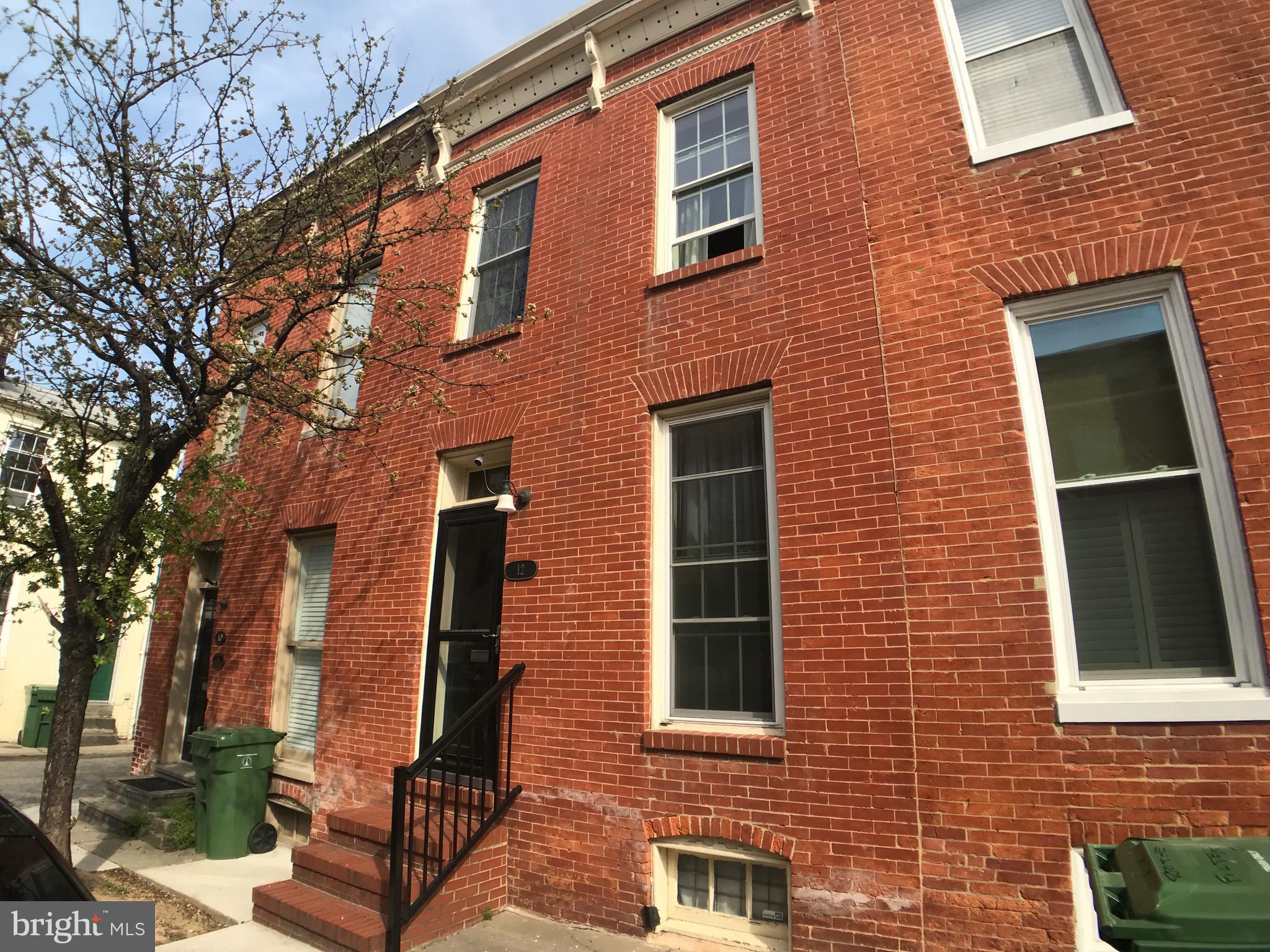 Great 2 bedroom home with PARKING! This home features wood floors, LR, DR, nice kitchen, rear patio, 2nd floor features two bedrooms and 1 full bath to 2nd floor rear deck. Close to Cross Street Market and Inner Harbor. Enjoy the City Life