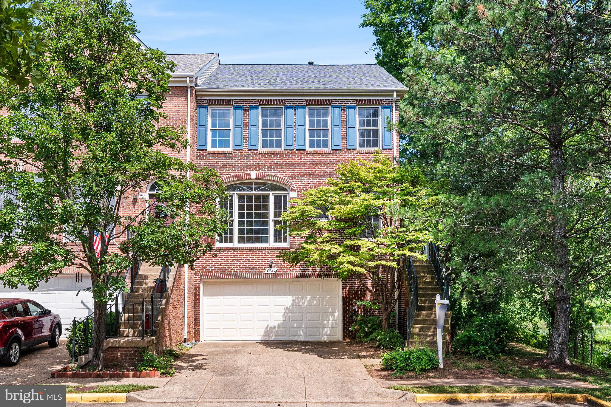 Stately end-unit brick-front townhome just down from the Vienna Metro, offering over 2,000 square feet of well-designed living space. This 3-bedroom, 3.5-bath home features brand-new carpet on all three levels and new hardwood flooring in the foyer and dining room. The open floor plan includes a spacious dining room that flows into a large living room with a dual-sided fireplace shared with a cozy sitting room. From the sitting room, step out onto a generous deck that overlooks a private, fenced backyard—perfect for outdoor entertaining or relaxing.
Upstairs, the expansive primary suite boasts vaulted ceilings and a large en-suite bath with a dual-sink vanity, soaking tub, and separate shower. Two additional bedrooms and a full hall bathroom, also with a dual-sink vanity and tub-shower combo, complete the upper level. The fully finished lower level offers high ceilings, a sizable family room, a full bathroom, and walk-out access to the fenced backyard.
Enjoy the unbeatable convenience of being just two minutes from the Metro, with easy access to I-66, downtown Vienna, local restaurants, grocery stores, and shopping. This home combines space, comfort, and an ideal location for modern living.