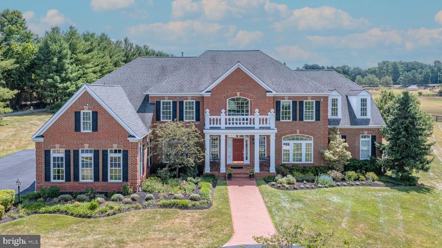 Welcome To 18668 Grove Church Court! Privacy, Property, And Proximity Abound On A Private Retreat With 5+ Acres, With No HOA! This Colonial 5-Bedroom, 4.5 Bathroom All-Brick Home Boasts Over 6100 Square Feet Of Pristine Living Space, Complemented By A 3-Car Side-Load Garage And A Circular Driveway. The Main Level Harmoniously Caters To Both Everyday Comfort And Entertainment, Boasting An Inviting Two-Story Foyer Complete With A Dramatic Dual Stairway Framed By A Library And Dining Area, A Study, And A Spacious Two Story Light Filled Family Room With Coffered Ceilings Which Is The Hub Of The Home. For Working At Home While Also Enjoying The Views, An Oversized Solarium Is Flooded With Natural Light From Two Walls Of Windows And A Wall Of French Doors Leading Out To A Flagstone Patio. The Gourmet Eat In Kitchen Features New Stainless Steel Appliances, Granite Countertops, Coffee Bar, A Large Sixteen-Foot Center Island, Plus An Additional Oversized Separate Eat-In Area. Step Out Through The French Doors In The Kitchen To A Large Flagstone Patio Perfect For Your Morning Coffee, And Entertaining All While Taking In The Beauty Of The Surrounding Acreage And Horse Farms. The Upper Level Features A Spacious Primary Suite With Sitting Room, A Spa Bathroom With Dual Vanities, Soaking Tub, And Oversized Separate Shower. There Are 3 Additional Ensuite Bedrooms On The Upper Level. Enjoy Peace Of Mind Knowing A Whole House Generator Is Installed Should It Be Needed. Recent Updates Include Newly Finished Hardwood Floors And Freshly Painted Walls Throughout, New Carpet, New Exterior Paint, New Water Softener, HVAC’s And Furnaces Replaced In 2016 & 2017. Come See This Home With The Space And Privacy That Cannot Be Found In Many Other Neighborhoods, Especially With The Convenience Of Downtown Leesburg And Dulles Airport Only Minutes Away.