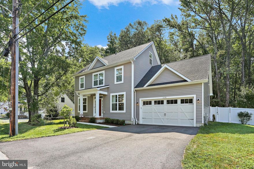 Located in the sought-after water-oriented Cloverlea community of Beverley Beach, this stunning Colonial built in 2023 blends modern comfort with timeless coastal charm. Situated on a rare double lot, the home offers 5 spacious bedrooms and 3.5 bathrooms across three beautifully finished levels. Step inside to an open-concept main level that’s perfect for entertaining, featuring generous living and dining areas filled with natural light. The second floor boasts 4 bedrooms and 2 full baths, including a luxurious en suite in the primary bedroom. A private fifth bedroom with a full bath is located on the third level, ideal for guests, a home office, or a flex space. Enjoy outdoor living on the expansive composite deck, all within a fully fenced backyard with  wooded views enclosed by low-maintenance vinyl fencing. Enjoy the convenience of being just a short walk from the marina, Chesapeake Bay, Beverly Beach, and the community boat ramp.