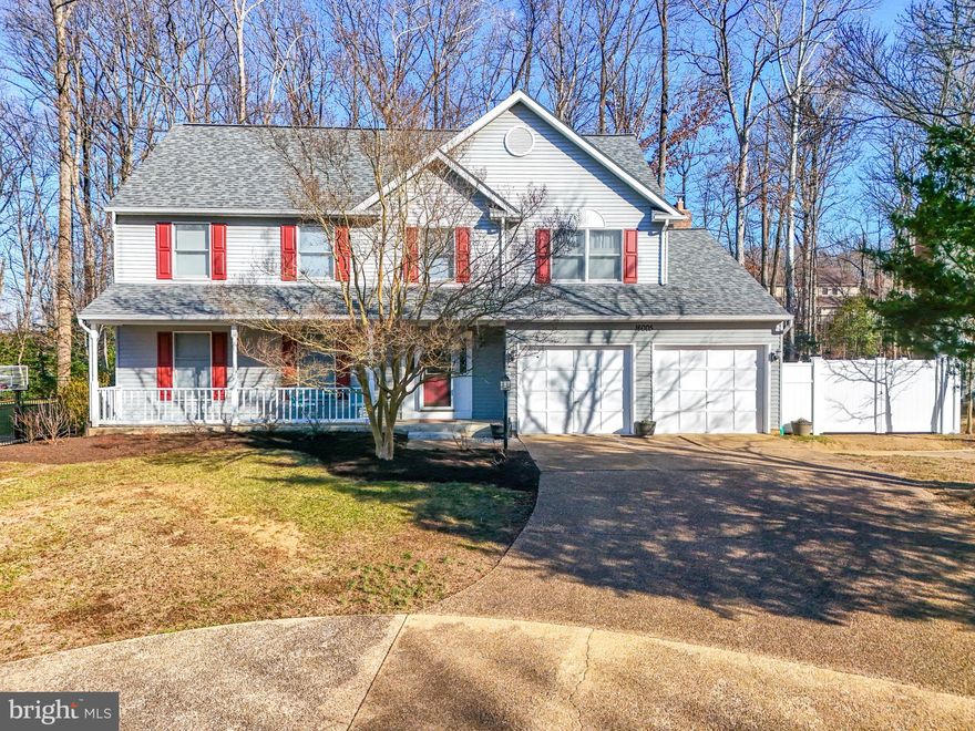 Welcome to Newport Estates, a charming, wooded community nestled along Neabsco Creek in Woodbridge, VA. This is a water-lover's dream without water-lover's prices. Less than a mile in one direction is Hampton's Landing Marina for easy boat storage and access to the Potomac, and Leesylvania Park with boat put-in, a beach and play areas, nature center and open picnic space along with several pavilions (and many other features). Less than a mile the other direction is access to the new Neabsco Creek Boardwalk with its activities and Christmas light show. Or, just walk your canoe or kayak right across the street to the wetlands, put it in the water, and paddle your way to contentment. Located on a quiet cul-de-sac you'll find your charming Colonial-style residence. A two-car garage, concrete parking pad and circular drive provide plenty of space for autos. Your home backs to woods and it is as quiet as quiet can be on the back deck where you can enjoy your morning coffee and evening BBQ parties. Step from the charming covered front porch into a main level with new hardwood floors, a generous-sized foyer and a light-filled living room. The heart of the home overlooks the woods and features an open-concept space from one end of the home to the other. The kitchen has been tastefully redone to include a HUGE eat-on island, tile backsplash, and self-closing drawers/cabinets in abundance. There is plenty of elbow-room for two cooks to work together in this gourmet kitchen while your guests nosh and chat while seated at the island. Dishwasher is new in 2024, range and refrigerator date from 2021. Adjacent to the central kitchen and open to it there is plenty of room for a full dining suite, a separate breakfast nook (or use as extra office space) and a large rec room with a fireplace and doors to the back deck. Not to be missed is a separate space containing the half-bath and the main-level laundry room. Access to and from the garage is on this level. On the upper level you will find flooring updated in 2021, four HUGE bedrooms with nice-sized closets, and two oversized hall closets for linens or extra storage, as well as an ensuite and hall bath. The basement is unfinished (waiting for your design choices!) but features a full-bath rough in to get you started toward the rec or guest space of your dreams . The HVAC has been cleaned and serviced regularly and the coil and outside unit were replaced in 2018. Water heater is new in 2020. What a location -- quiet, yet close to everything:  fewer than two miles from the VRE, a major bus route just down the street, Stonebridge Center (Alamo Theater, Wegmans, fine dining) & Potomac Mills 2 miles, commuter lots for bus connections/slugging 2.5 miles. With a cul-de sac location backing to woods, close proximity to water, park and transportation options all around, and just about everything new or newer inside...your new home is just waiting for you to move in and call it your own!