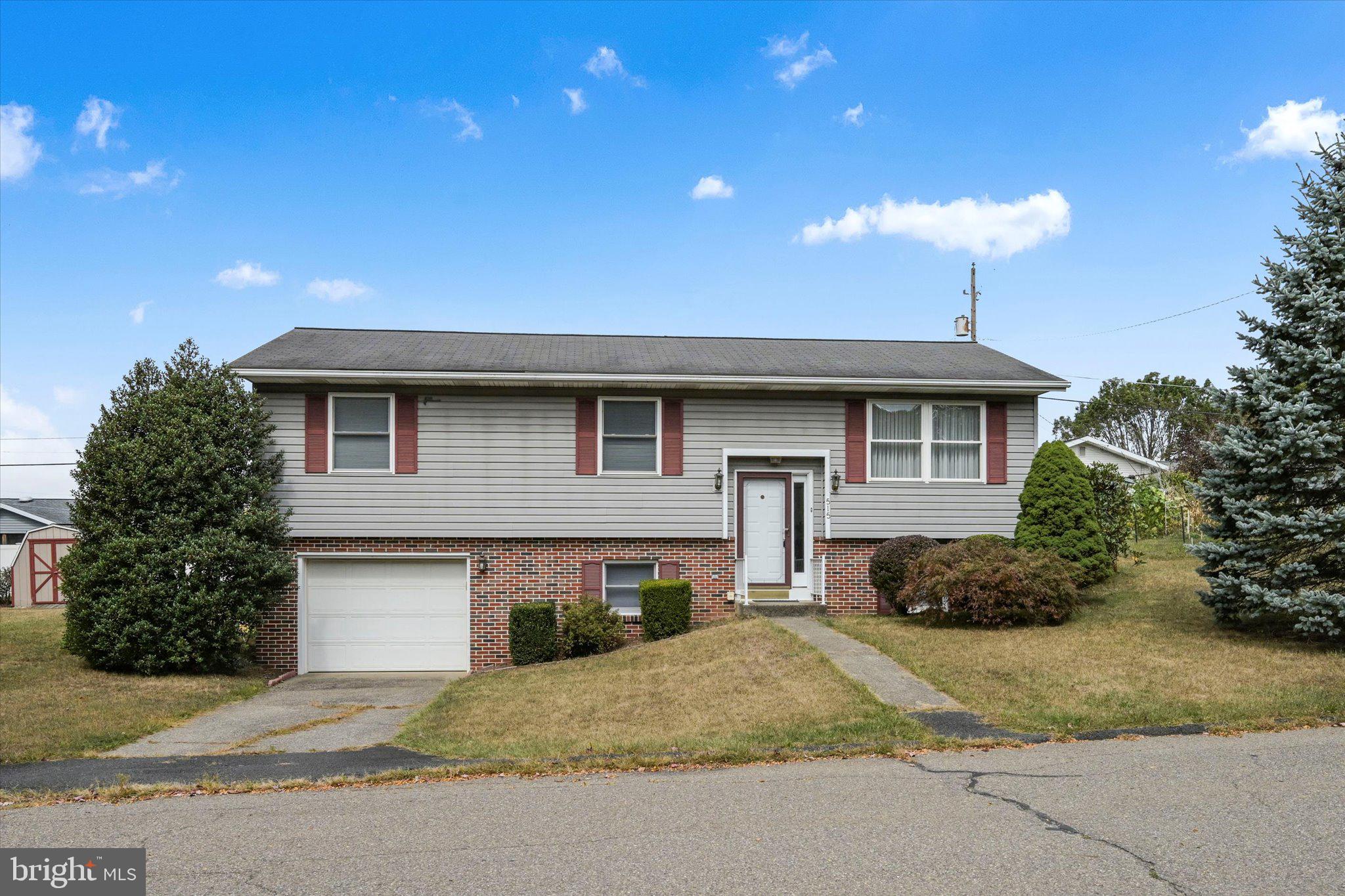 Welcome to this well kept bi-level home in Pottsville offering 3 bedrooms and 1.5 baths. The bright main level features a comfortable living room with mini-split A/C, updated kitchen with newer cabinets, and space for everyday living or entertaining. The lower level adds convenience with a laundry room, garage access, and extra bedroom office or storage potential. Step outside to enjoy the spacious backyard complete with a beautiful deck and mature landscaping perfect for relaxing or gatherings. This layout provides a great foundation to personalize and update over time. Pride of ownership is clear throughout, making this home a solid choice for your next move. Call to schedule your showing today!