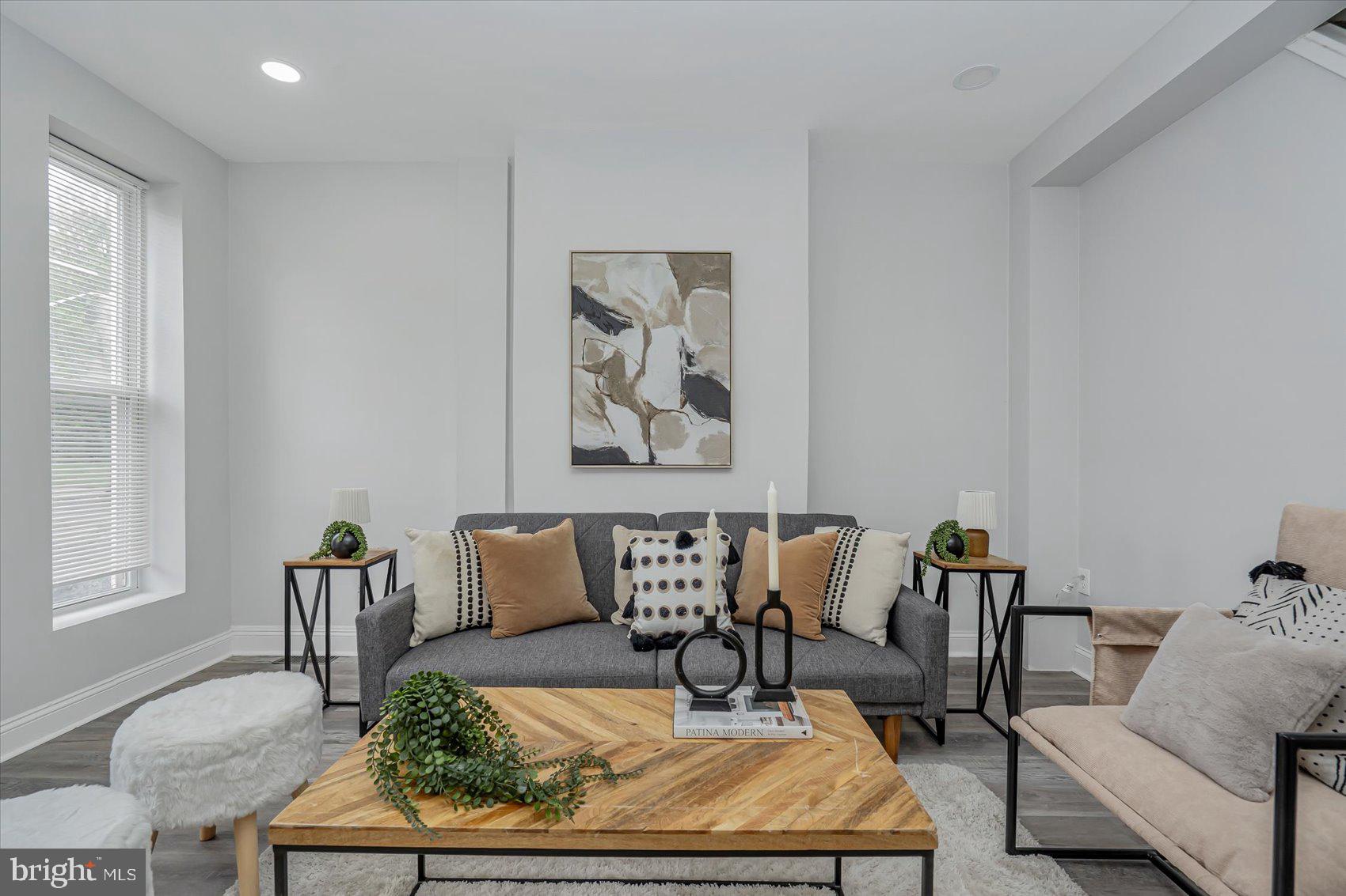 Transformed 2BR/2BA traditional Baltimore Townhome located in an up and coming neighborhood. Step inside an amazing main floor boasting tons of natural light, a soft color palette, luxury flooring, recessed lighting, and the exposed brick wall which beams with original character. The large living room offers a view of the open concept dining room and kitchen. The kitchen boasts plenty of cabinets, stainless steel appliances, granite countertops with a subway tiled backsplash, and a stainless sink under the window. The newly carpeted second floor features a spacious secondary bedroom with a private en suite boasting a beautifully tiled walk-in shower and a vessel sink vanity. In addition, the large primary offers tons of light, a large closet, and a private en suite with a vessel sink vanity. The lower level offers additional living space with luxury flooring, a spacious family room, a possible third bedroom or home office, laundry, and storage. From the kitchen step outside to a wood deck ideal for a grill that overlooks the newly fenced yard offering tons of possibilities. This home is move-in ready with so much to offer new homeowners including new windows and HVAC. Imagine all this and in close proximity to shopping, restaurants, and commuter routes.