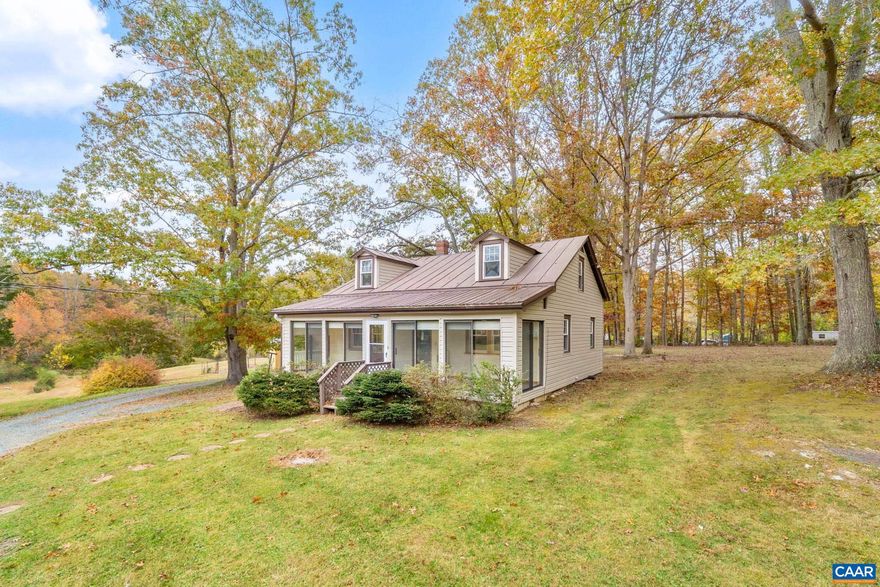 Built in 1953 on 2 acres, this home retains character. The front entrance has a glass sunroom-style sitting area where you can unwind with your morning coffee or tea while taking in views of the mature trees. Outside, the yard provides plenty of room for garden beds, family gatherings, or simple enjoyment of the peaceful setting. Conveniently located 20 minutes from Charlottesville.,Formica Counter,Wood Cabinets