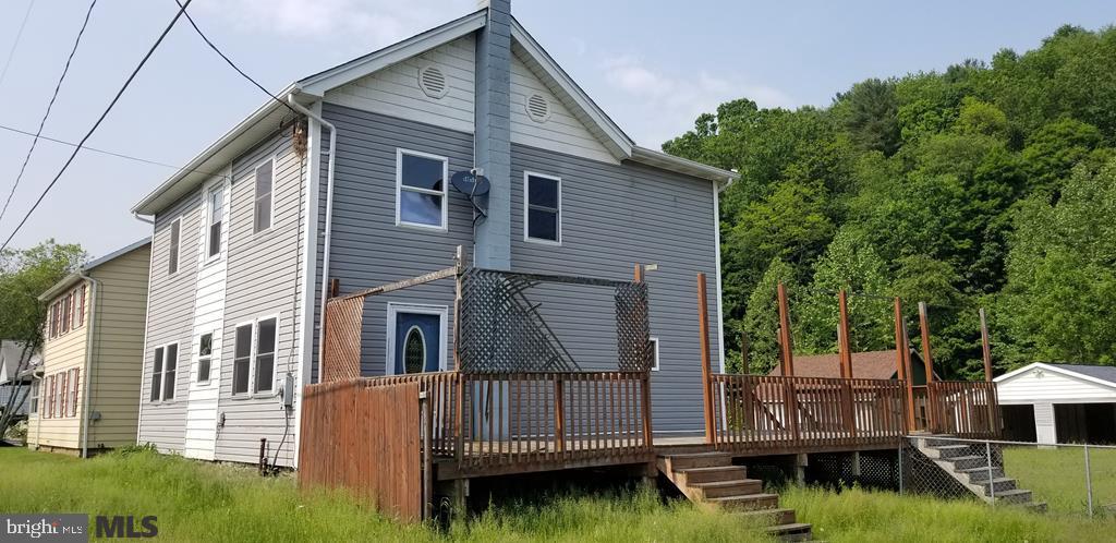 Three Bedroom two bath home with a detached two car garage. Home has a large backyard with stream behind garage.