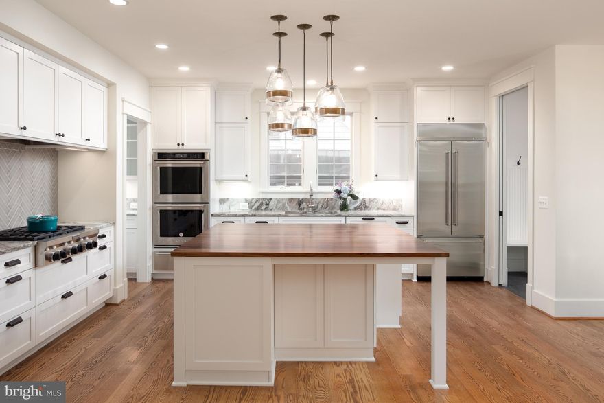 Gorgeous new construction by Windmill Hill Design Build. Fabulous, gourmet chef's kitchen, designer finishes, stunning hardwoods. Four bedrooms on the upper level with a private master retreat. Large closet and beautiful ensuite bath. Main level with office, formal dining room, mud room, family room off kitchen and breakfast nook. Lower level with large recreation room, wine bar and storage, full bedroom and bathroom and workout room. High-end windows, beautiful trim and woodwork and superb lighting complete this amazing new construction home.