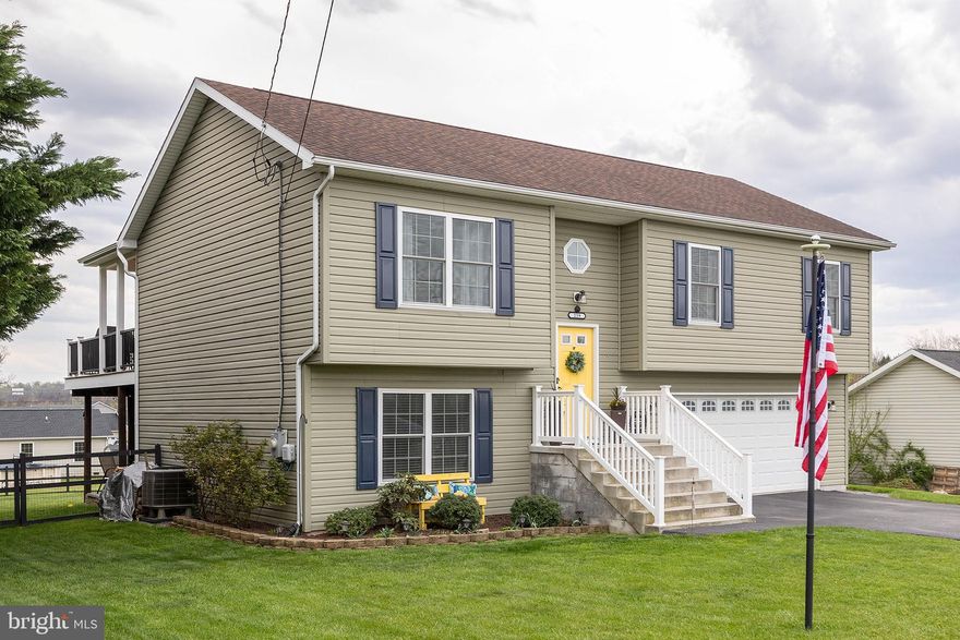 Charming 3-Bedroom, 3-Bathroom Home in Elizabeth Station Community, Berkeley, WV. 
This stunning residence features three spacious bedrooms, three full bathrooms, and upgrades that promise a blend of comfort and style.

Step inside to find a beautifully finished basement, complete with a full bathroom for added convenience. This walk-out basement opens up to a patio, perfect for outdoor entertaining and relaxation. The heart of the home shines with stainless steel appliances, a dazzling backsplash, and a newly added island bar that invites gatherings and culinary adventures.

Outside, experience the ultimate backyard oasis. An oversized Trex deck, recently added, not only enhances the home's aesthetic appeal but also offers a seamless transition to the outdoor living space. The backyard had a recent addition of a full fence, ensuring privacy and security while creating an inviting retreat perfect for relaxation or entertainment. Stairs from the deck lead down to the patio, creating a fluid indoor-outdoor living experience, further elevating the allure of this stunning outdoor area.

 The addition of a tankless hot water heater and a comprehensive house water softening system ensures your comfort and convenience year-round.

The property is set on a generously sized lot, surrounded by meticulously landscaped gardens. Whether you're hosting a summer barbecue, enjoying a quiet morning with a cup of coffee on the deck, or simply taking in the serene views, this home offers the perfect setting for making lasting memories.
This home, with its thoughtful upgrades and prime location in the Elizabeth Station community, won't stay on the market for long. Schedule your viewing today.