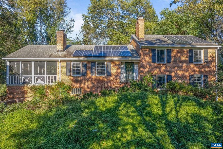 This handsome brick home sits on a coveted location in the community of Bellair, backing to the beautiful Birdwood Golf Course, protected from road noise yet it's easy to access the Rt 29/250 Bypass and get to wherever you need to go--north, south, east, or west. An 8.7 kW Solar System produces enough power that between net metering and the sale of energy credits, the cost of electricity for this home approaches zero. The primary bedroom suite includes a large attached bath, a walk-in closet, and separate cedar closet. The kitchen has glass front maple cabinetry, stainless appliances, and custom concrete counters. Enjoy entertaining on the spacious (450 sqft) screened porch just off the Dining Room. Beautiful hardwood floors on upper levels and New Zealand wool carpet on lower levels, thermal windows and doors and 2 wood burning fireplaces--one with wood stove insert. Access the hiking trails at Foxhaven Farm from the end of Canterbury Rd only a few blocks away or walk to the nearby community pond. Watch the sunset over the mountains from the edge of the golf course. Large 1+ acre lot has lots of space for gardening and games. Paved driveway has extra parking spaces for guests. Plenty of storage in a walk-up attic & the garage.,Glass Front Cabinets,Maple Cabinets,Fireplace in Family Room,Fireplace in Living Room
