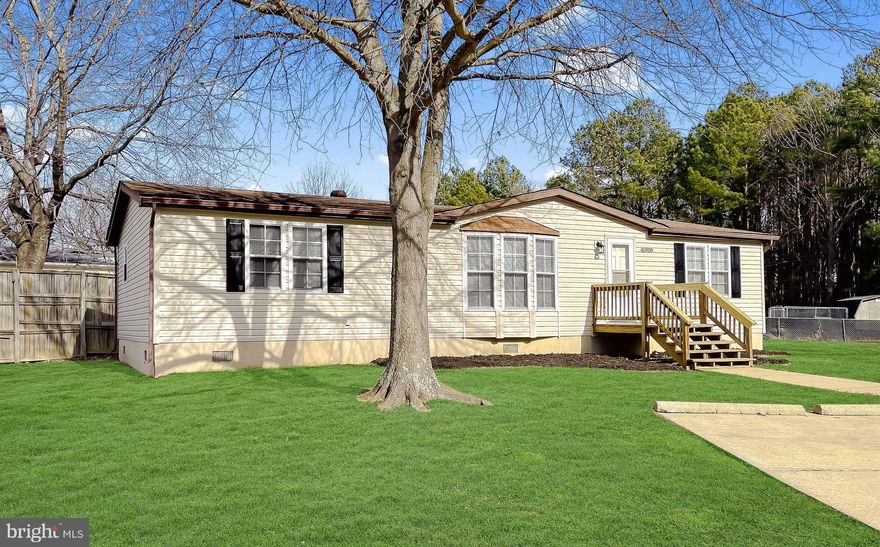 Charming Three Bedroom, One Level Rambler at the end of a Cul-De-Sac within walking distance to shopping, gym and restaurants.  Beautifully remodeled with an Open Concept Floor Plan and Luxury Vinyl Plank Flooring throughout. Bright Kitchen with Stainless Appliances, Tons of Storage and Butcher Block Island with Extra Seating. Large Living Room perfect Relaxing or Entertaining.  Separate Chic Dining Area leads out to a Large Deck with plenty of space for both Lounging and Al Fresco Dining. Lovely Primary Suite with Walk-In Closet and Full En Suite Bathroom. Two Additional Large Bedrooms with Sizable Closets.  Utility Room with its own Exterior Entrance boasts plenty of space for a future Full Washer and Full Dryer.  Premium Lot, one of the largest in the neighborhood, with no thru street and Private Parking. Concrete Pad in the Backyard perfect for Firepit or Future Shed.  Only three minutes from the U.S. Post Office, five minutes from Patuxent River NAS and six minutes from Urgent Care. A Sweet, Happy Home.