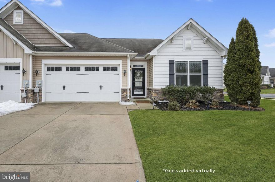 Welcome to this beautifully maintained 2 bedroom, 2 bathroom twin home in the highly desirable retirement community of Longacre Village — offering thoughtful upgrades, standout features, and move-in ready comfort. Hardwood floors and fresh neutral paint create a bright, welcoming atmosphere throughout the main living areas, while the bedrooms feature brand new high-performance fiber R2X stain-resistant carpeting for lasting durability and comfort. The kitchen is truly the heart of the home, showcasing granite countertops, stainless steel appliances, and an impressive oversized island with dual sided storage & a breakfast bar — perfect for everyday living and effortless entertaining. The spacious living room is centered around a cozy fireplace, creating a warm focal point, and is enhanced by upgraded plantation shutters on all main living area windows for added style and privacy. The primary suite is a peaceful retreat, featuring elegant tray ceilings, a generous walk-in closet, and a private bath complete with a double sink vanity and walk-in shower. A second bedroom and full bath provide comfortable space for guests or a home office. A bright and airy sunroom/Florida room — a delightful upgrade — offers flexible additional living space year-round perfect for enjoying your morning coffee, reading a book or entertaining. This home is one of the rare twin models and includes a spacious two-car garage, adding both convenience and value. The HOA provides lawn maintenance and snow removal, allowing you to enjoy a carefree lifestyle. Residents also enjoy access to a community pool, recreation center, walking trails, sidewalks, and a full calendar of community events! Two popular restaurants and the Kent County Public Library are within walking distance, making it easy to stay active and connected. If you’ve been searching for a well-appointed home in a vibrant, walkable community designed for comfortable living, this exceptional property is ready to welcome you.