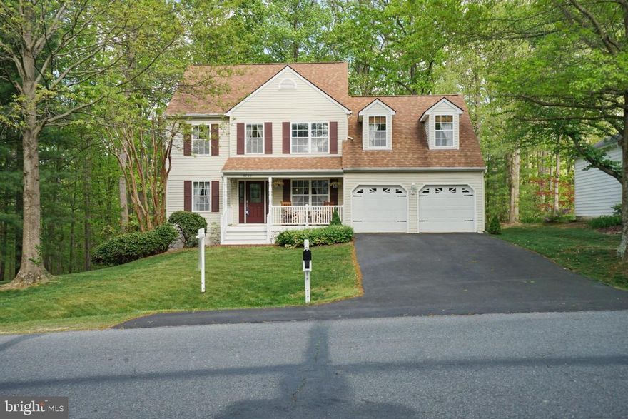 Amazing opportunity to live in sought-after Lee’s Hill!  This home has sooo much space, and it backs to common area so no homes will be built behind you ; )
This well-maintained home boasts an inviting front porch and 2-car garage.  As you enter thru the front door, you will have the combination living room/great room area to you left and the dining room and kitchen to your right.  Notice the lovely hardwood floors throughout the main level and the fireplace in the living room!  Stainless steel appliances, quartz countertops, and newer cabinets adorn the spacious kitchen, complete with breakfast nook and butler’s pantry.  There is also a powder room on the main level.  On one end of the 2nd floor you will find the spacious owner’s suite with adjacent master bath with granite countertops and walk-in closet.  And checkout the heated floors in the master bathroom, which are programmable so you can wake up to a warm bathroom floor for your morning shower!  You will also notice another set of stairs leading to the THIRD level.  This is a great space for a home office or additional sitting area/private retreat!  On the opposite end of the 2nd floor is a very large bedroom (currently used as an office) over the garage, with cute dormer windows.  The possibilities for this room are endless!  Two additional bedrooms and a full bath complete the 2nd floor.  The unfinished basement has roughed-in plumbing for a bathroom and an egress window, plus sliding glass doors leading to the backyard.  There is a patio on the ground level out back, and a deck above it.  The backyard is level and backs to trees!   
Close to the VRE and other commuter options, shopping and dining at Cosner’s Corner, and a short drive to downtown Fredericksburg. Only one block from the walking trails!