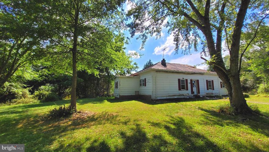 One level home with three bedrooms, on a partially cleared wooded five acre lot with a private setting located near historical Fredericksburg VA and within eleven minutes to Bealeton VA, this property has a second home and a large barn ideal for storage.  Living room, family room adjacent to dining room and a large laundry room. Friendly quiet neighborhood, an investor's dream. No HOA