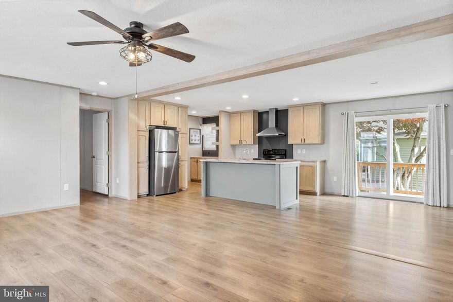 SELLER CONCESSION: Seller offers 3 months' lot rent credit to a buyer at settlement. Discover this stunning 2023-built manufactured doublewide home located in the highly desirable Colonial East community in Rehoboth Beach, Delaware. Offering an open floor plan and beautifully designed interiors, this home places you just minutes from world-class outlet shopping, countless restaurants, vibrant entertainment, and miles of breathtaking coastline. Whether you love boating, fishing, or embracing the salt-life lifestyle, it’s all right at your fingertips. Step inside to find a bright and spacious kitchen featuring stainless steel appliances, a stove/range with hood fan, a center island with a large sink and dishwasher, plus a convenient coffee bar—perfect for morning routines or entertaining guests. The large living room, complete with a ceiling fan, provides a welcoming and comfortable space to relax. The primary bedroom offers a peaceful retreat with its own ensuite bathroom, showcasing dual vanity sinks, a step-in shower, and a generous closet. Two additional guest bedrooms share a well-appointed full bathroom, providing plenty of space for family or visitors. Residents of Colonial East enjoy optional HOA membership, which includes access to a clubhouse, outdoor pool, and a tots’ playground, adding value and convenience to this fantastic location. Move-in ready and close to everything Rehoboth Beach has to offer—this home is your perfect coastal getaway or year-round sanctuary!