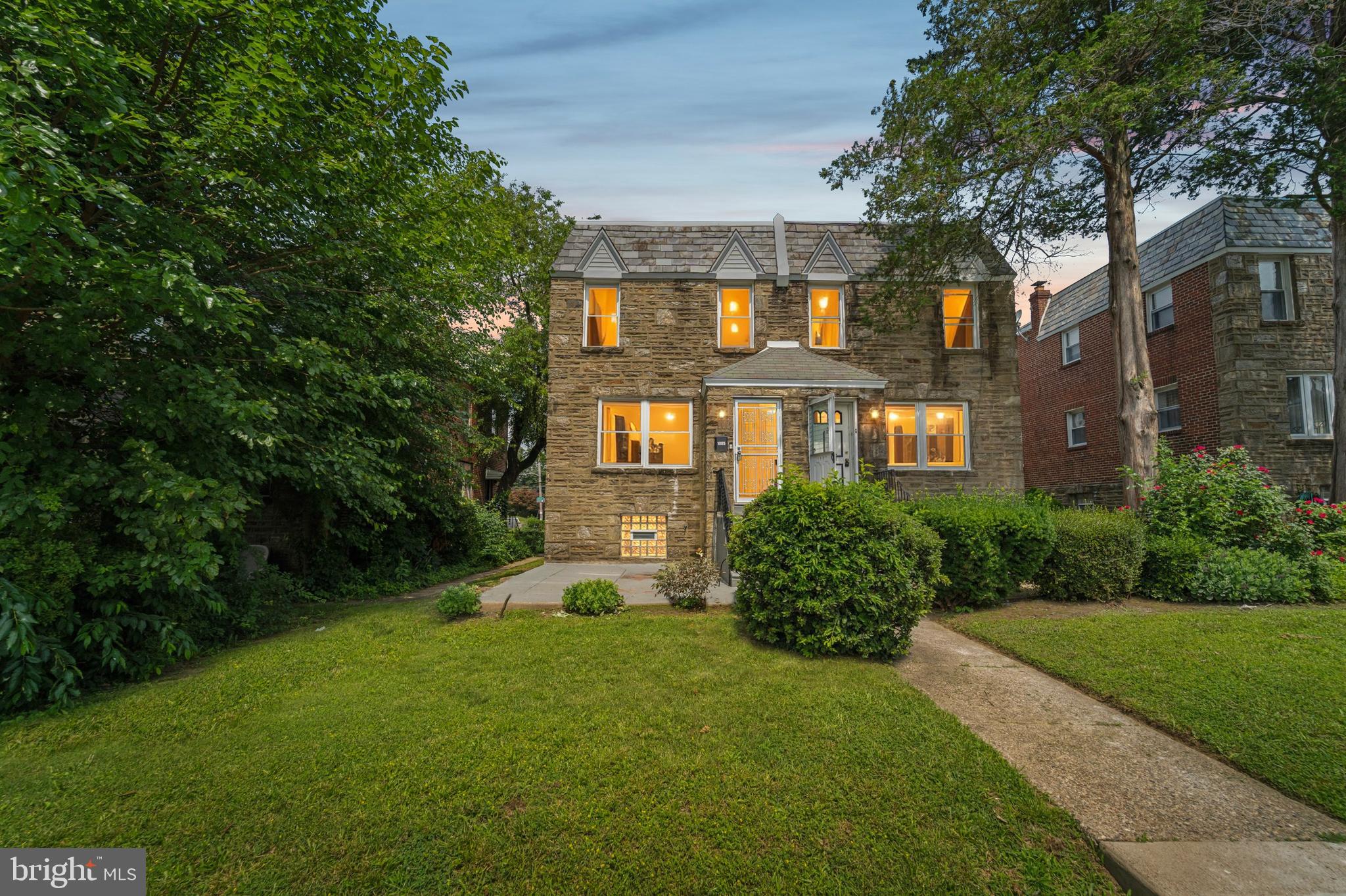 Welcome to 1005 E Dorset Street — a stylish, move-in ready retreat nestled on a quiet, tree-lined block in the Cedarbrook/Mt. Airy pocket of Northwest Philadelphia. This spacious 3-bedroom, 2.5-bath home combines modern updates with timeless comfort. Step into an airy open layout filled with natural light, where recessed lighting and wide-plank floors set the tone for everyday ease and elegant entertaining. The gourmet kitchen is the heart of the home — outfitted with sleek cabinetry, stainless appliances, and stone countertops — ideal for everything from morning coffee to dinner parties. Enjoy summer evenings dining al fresco on your front patio, or host friends in the finished lower level, perfect for movie nights, a home gym, or bonus living space. The private ensuite in the primary bedroom offers a tranquil escape, while generous bedrooms throughout provide space to live, work, and unwind. With in-home laundry, a private garage, and two-car parking, convenience is built in. Just blocks to shopping, parks, regional rail, and the vibrancy of Mt. Airy and Chestnut Hill, this home offers both serenity and connection in one of Philly’s most livable neighborhoods.