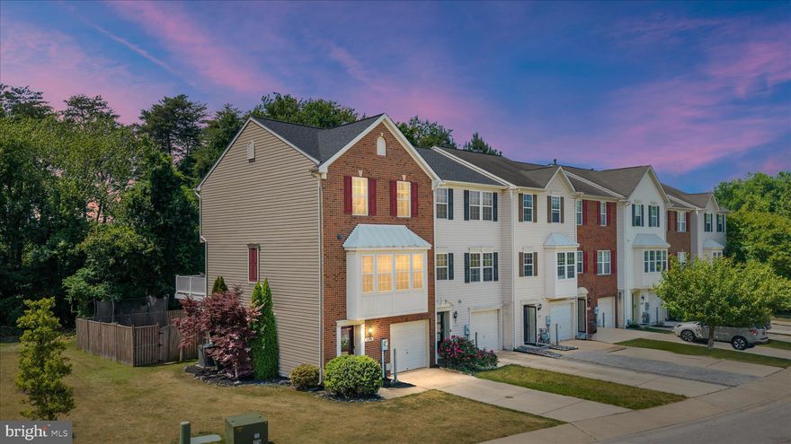 Move right into this beautifully maintained brick front end unit townhome offering space, natural light, and resort style community amenities. Recent updates include a brand NEW architectural shingle roof (2026), NEW carpeting (2026), Trane HVAC system (2020)

The home features a 1 car garage with built in shelving for additional storage, along with a driveway, plus additional parking for guests or extra vehicles just across the street.

The lower level features a convenient half bath, direct garage access, and a spacious bonus room that has  been used as an optional 4th bedroom, offering flexibility for guests, a home office, gym, or additional living space.

The main level offers hardwood floors, an open concept layout, spacious kitchen with granite countertops, Newer stainless steel appliances, a kitchen island, pantry, and a spacious dining area that all flows seamlessly into the living room, making it perfect for everyday living and entertaining. Large windows throughout the main level fill the space with natural light. Step outside to the rear deck with trex decking and vinyl rails, ideal for cookouts and relaxing, overlooking the fenced rear yard backed to an unbuildable wooded area for additional privacy.

Each level of the home includes a bathroom for added convenience. The upper level includes 2 full bathrooms, including a spacious primary suite featuring hardwood floors, soaking tub and separate shower.

Enjoy resort style amenities including inground pools, a 24 hour fitness center, clubhouse, dog park, garden center, basketball courts, tennis courts, parks, and scenic trails for jogging and biking. Conveniently located just a few miles from BWI Airport with an easy commute to Fort George G. Meade, Baltimore, and Annapolis. This location offers easy access to major commuter routes while still enjoying a peaceful community setting.

This is a wonderful opportunity to own a truly move in ready home in a highly desirable community.