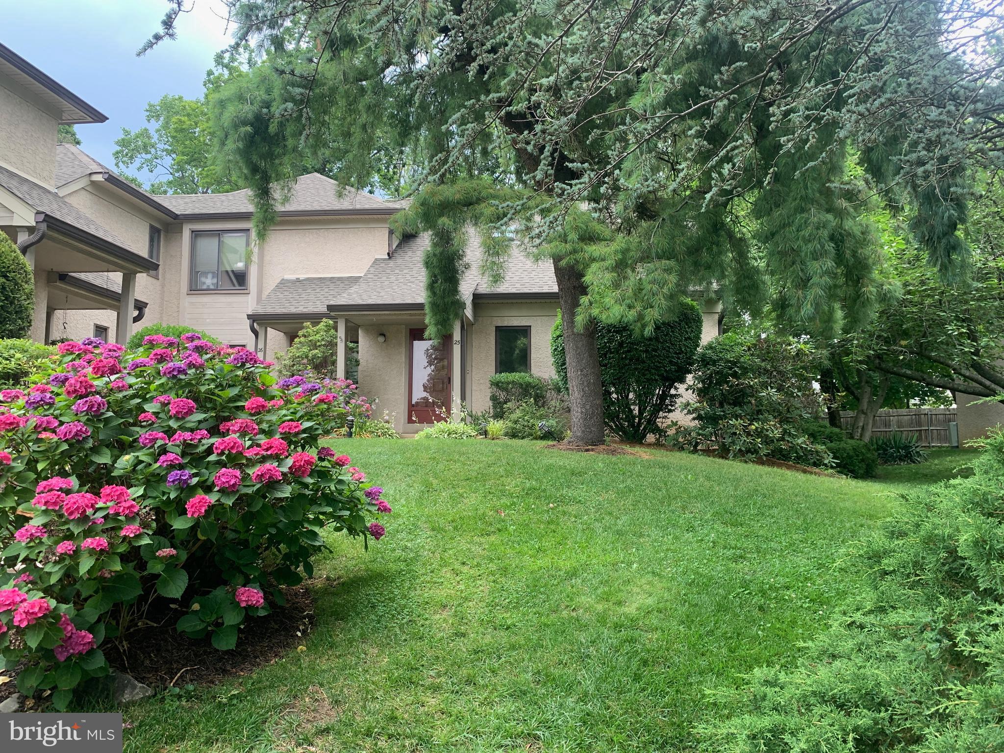 A Great find in Media. Oakmont end unit townhome with first floor bedroom and Bath plus 2nd floor Bedroom and Bath suite. MAIN level offers Covered Entryleading to the Foyer with closet, Living Room with vaulted ceiling, corner fireplace and big, bright bay window, Dining Room with vaulted ceiling and sliders to large side Deck, White Kitchen with room for a table, French doors to Bedroom or Office, with walk in closet and private access to full Bath. Full Bath with tub/ shower. UPPER Level offers a bonus space overlooking main level plus spacious Primary Bedroom with 2 large double closets, Ceramic Tile Bath with skyline, double bowl vanity, tub/ shower combo. the BASEMENT is huge, unfinished with Laundry and wash tub, ample workshop and tons of storage. The possibilities are endless ! The One Car Garage with opener, completes the package for this affordable chance to be in Media Borough and close to all that State Street has to offer without being on top of it. Maintenance free living with a reasonable monthly fee makes this a great place to call home.