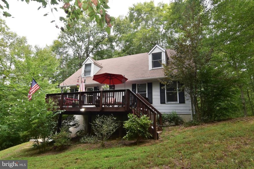 Cape cod located in Hollywood with close proximity to Leonardtown.  2 bedrooms on main level & 2 on upper level with a loft.  Basement is partially finished with family room/ rec room with pellet stove.  Storage room. Shed. Deck overlooking private back yard. Peaceful setting, wooded area.  Close to shopping, schools, hospital, library, & restaurants.