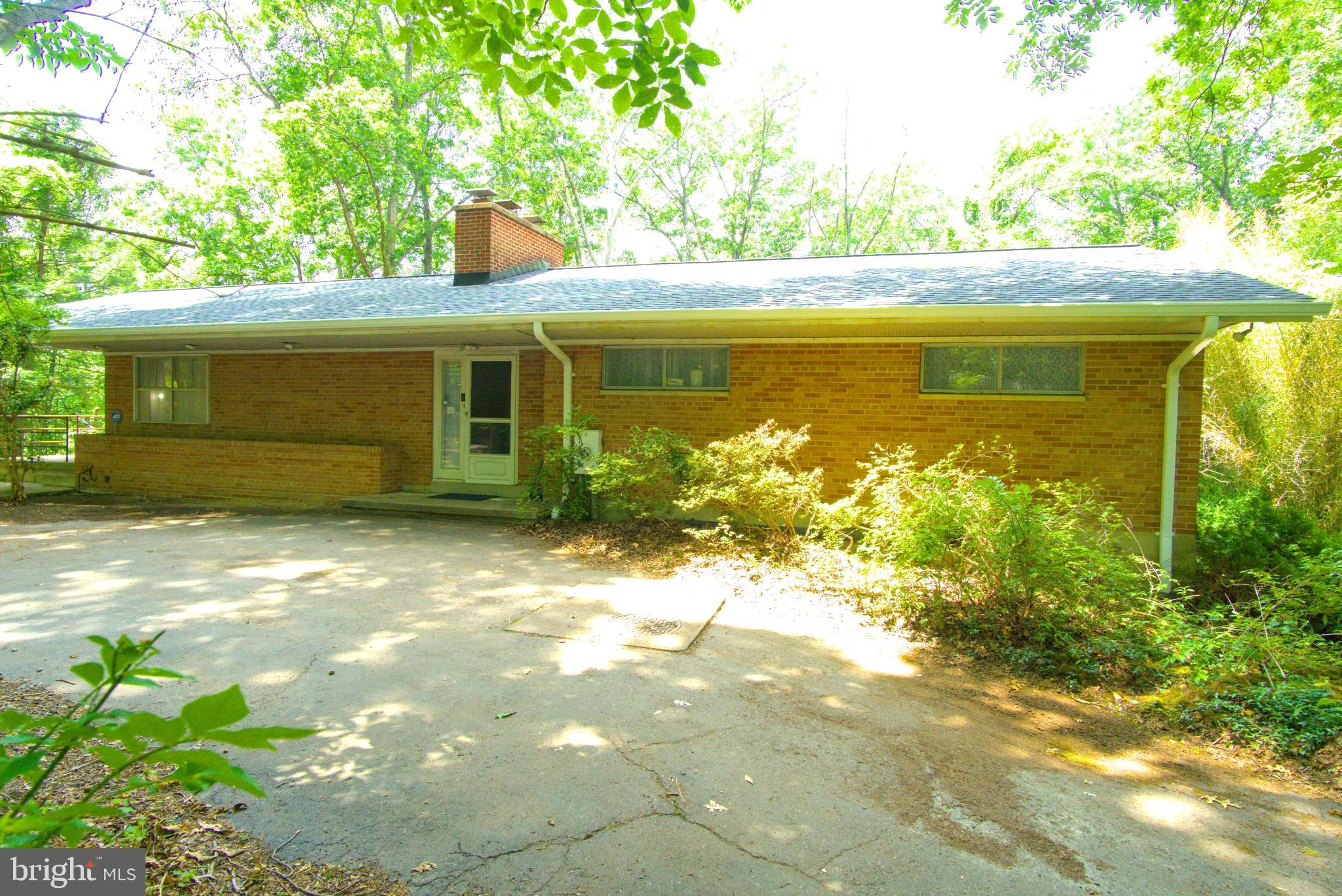 All are welcome, appointments only, no trespassing, thank you! We’re excited to present a rare and unique real estate opportunity in Fairfax County. Perfect for families, developers, or real estate investors, looking to create a lasting legacy. Priced attractively at $775,000, this solid brick 3 bedroom, 3 bath rambler style home has a brand new roof and attic insulation, full walk
-out basement, sits on a secluded 3.86 acre wooded lot. It backs up to a peaceful creek and offers breathtaking sunset views!! This is an ideal foundation for a multi-generational retreat, private estate, or multi use investment property.
Built with brick and block construction, this home is incredibly well insulated and durable. While the kitchen and baths are functional but ready for updates, the home offers significant potential to expand and modernize. With proper permitting, there is space to build an additional structure. Perfect for accommodating extended family or generating rental income.
Key features include:
No HOA for more freedom and flexibility. Full walk-out basement that's unfinished and offers tons of potential for an in-law suite or rental unit with its own parking and entrance! Two fireplaces. Upper and lower patios. Circular driveway and multiple parking options. Abundant wildlife, stream views, and incredible sunset skies. Room for chickens and hobbyist farming - ON YOUR OWN LAND!! Private well with city sewer (water recently inspected and is great!), and city water & gas hookup available at the street. Located just minutes from Springfield Town Center, the Metro, and Fort Belvoir, and with easy access to the Fairfax County Parkway, this home offers both privacy and prime convenience. This is a property with endless possibilities, whether you’re planning a multi generational homestead, seeking rental potential, or envisioning a private family estate to pass down for generations. This is it! Seller will consider all offers to allow the next owner the freedom to bring their vision to life. While the seller reserves the right to accept an offer at any time. Reach out if you'd like more details or to schedule a private tour. This is a rare opportunity that won’t last long.