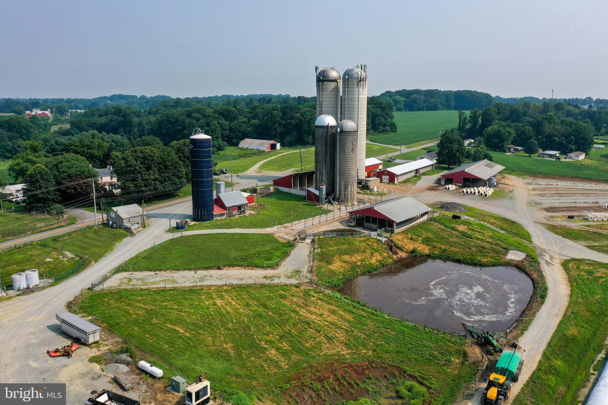 Secluded Southern Chester County Farm, 122.8 acres of fertile soil. Currently an active dairy farm, 600 cow free stall barn. Includes a double 16 GEA parallel parlor, offices, observation area, storage room, etc. Holding area, special needs box pens, transition barn and so much more! Facilities all new in 2003. Multiple heifer and calf barns plus dry cow barn for 60+ head. 3 bay open from commodity storage barn, numerous GSI grain bins w/augers. Includes the original farm house, a farm manager residence (beautiful and really well kept) plus 2 more homes for your additional farmhands. Too much to mention, schedule your appointment today! A must see for the serious dairyman.