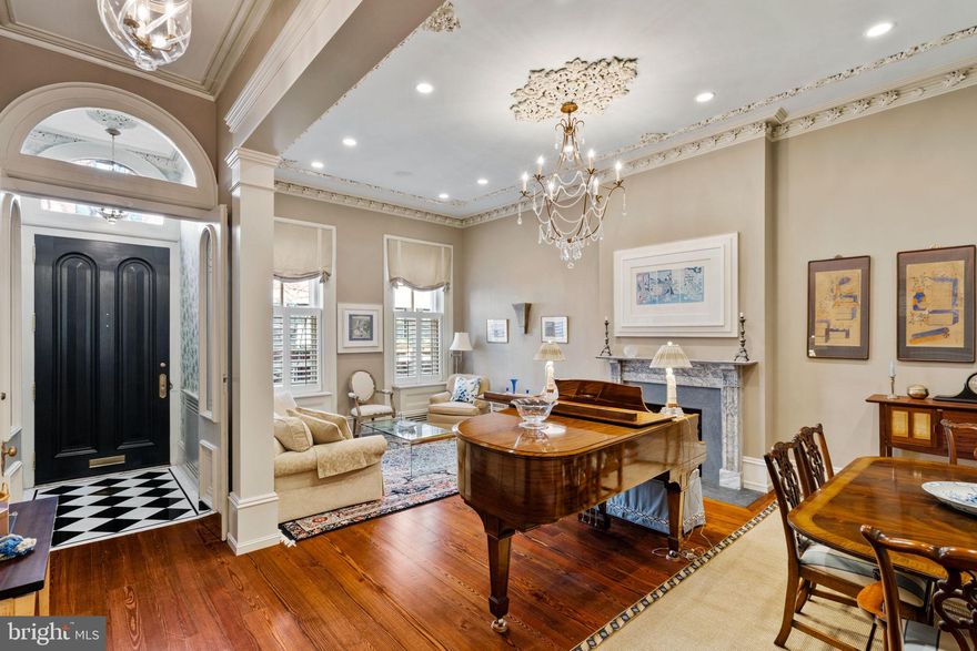 Presenting a haven of unparalleled luxury, 1812 Delancey stands as a testament to refined living in the heart of Philadelphia's prestigious Rittenhouse Square. Built in 1829 as part of the American Civil War era mansions, this townhome beckons connoisseurs of sophistication to indulge in a residence that seamlessly marries historic charm with contemporary opulence. Every detail reflects a commitment to refinement and indulgence spanning over 5000SF this 4-story townhouse boasts 5 bedrooms, 6.5 bathrooms, 2-Car Garage, elevator, and multiple outdoor spaces.   

As you step into the grandeur of the first floor, an enchanting entryway unfolds. Marble tiles caress the underfoot, paving the way to a realm of timeless elegance and leading to the custom-cut wainscotting that adorns the entire staircase. The foyer welcomes with custom-etched glass door inserts, an artful front door, and upscale hardware while etched glass lanterns illuminate the entryway and hallway with a soft, ambient glow. 

A meticulously gutted and rebuilt kitchen reveals new hardwood floors with historic charm. Custom-fitted kitchen cabinets, Quartzite countertops, and top-tier appliances evoke an atmosphere of culinary grandeur. A tri-fold window invites natural light to dance across the pristine surfaces—French doors open to the front room, creating a seamless flow of elegance while entertaining.

The living room transcends the ordinary, boasting custom-leaded reclaimed glass above the French doors, wainscoting throughout the first floor, and a bespoke china cabinet with reclaimed glass. Custom trim elevates the living space and highlights the resplendent chandelier. The powder room features new wood floors, a custom vanity, and new sconces. 

Ascend to the second floor, where each room is a testament to unparalleled sophistication. The primary suite exudes opulence with Blanc & Noir marble floors (with radiant floor heating), a custom-built linen and storage cabinet, and a masterfully crafted ensuite. Soundproofing ensures undisturbed tranquility, and a California closet system caters to the discerning resident's organizational desires. The spacious guest bedroom hosts a private bathroom adorned with White Carrara marble floors and Hunter Douglas shutters. 

The third floor unfolds with a meticulously renovated front bathroom, featuring matte black and white tile, a claw foot tub, and Hunter Douglas shutters. The front bedroom and spacious back bedroom exude comfort and style, adorned with Hunter Douglas shutters and new windows. The back bedroom hosts a private bathroom detailed with marbled floors (radiant floor heating), completing the third-floor sanctuary.

The fourth floor elevates the residence to unprecedented heights with redesigned cabinetry, a marble-clad wet bar, and state-of-the-art Sonos and Blu-ray systems. Crowning this architectural masterpiece is a resplendent roof deck, with a retractable canopy, irrigation system, and surround sound providing an enchanting backdrop for alfresco soirees.

The basement, a space of utmost functionality, hosts a fully renovated bathroom featuring Kohler fixtures, a custom radiator cover, and upgraded electrical panels. The newly painted garage now features a sink for added convenience.

Beyond the luxuriously appointed living spaces, the exterior is meticulously refreshed with a brick sidewalk and hardscaping, creating an idyllic streetscape. Throughout, motorized shades add a touch of modernity and convenience. The home was most recently fully renovated in 2015 by Sheridan Builders and has since had additional significant improvements made making this home move-in ready. 

Nestled in the heart of Philadelphia's iconic Rittenhouse Square, where rich history and contemporary allure converge to create an ambiance of timeless elegance, making 1812 Delancey an unrivaled address for those seeking not just a home, but an elevated lifestyle. This is not merely a home; it is an immersive experience in luxury living.