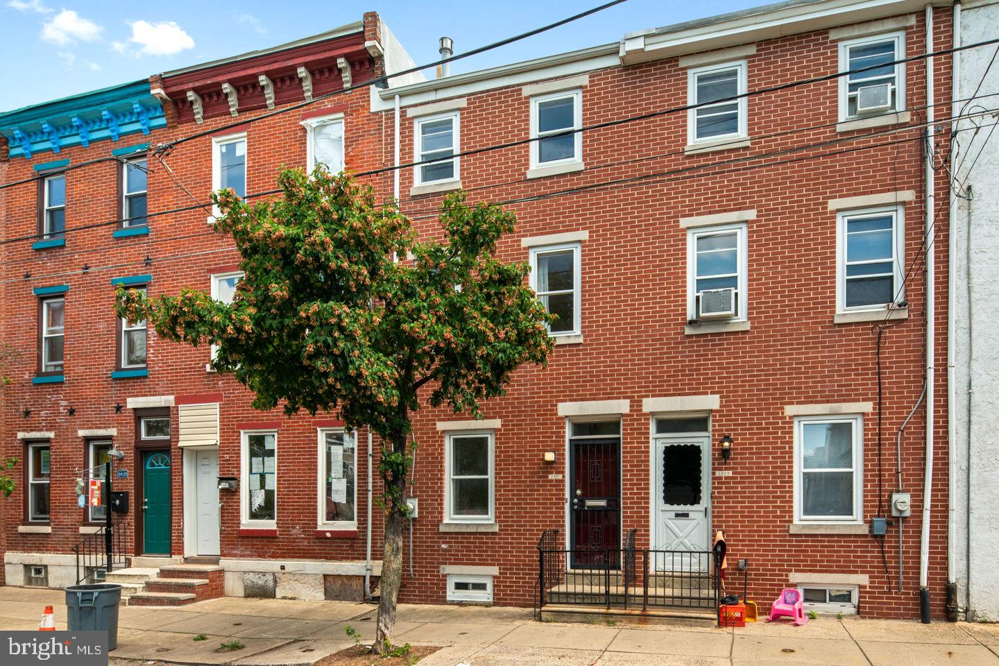 This sundrenched, right-sized home in the heart of East Kensington has it all - including secured, off-street parking! The home features hardwood floors, three large bedrooms with ample closet space, an updated bathroom, a convenient second floor laundry nook, a charming kitchen with stainless steel appliances, a full-height basement with potential to finish, and central heat and air conditioning. You'll enter into the sunny living room and continue past the central staircase to the dining room with built-in bookshelves. Continue through the kitchen, complete with pantry and loads of available counter space, outside to the gated backyard/parking area with a remote controlled roll up security gate that opens onto Martha Street. The second floor has a generously sized bedroom and laundry nook, and a full, just refreshed bathroom with new plumbing fixtures. There are two additional bedrooms on the third floor. All of the bedrooms in this home have dimming LED light fixtures and are large enough to comfortably accommodate at least a queen-sized bed and dresser, or a home office and fitness area. The basement is clean and a comfortable standing height, so it's perfect for finishing or using for storage. The central air system boasts a new furnace and programmable thermostat.  This street-to-street property is a rare find for the neighborhood, and with a roll down gate in the backyard, parking your car, bikes or motorcycle is a breeze, or use the space as a spacious enclosed backyard for relaxing or entertaining.  Across the street from the front of the house is “Letterly Green,” a neighborhood amenity under development and stewarded by the neighborhood association, EKNA.  Just a 10-minute walk from three Septa stations, you can be in Olde City/Center City in 20-25 minutes and I-95 is just minutes away by car. The home is conveniently located 1 block from Frankford Ave. and from well-loved neighborhood gems with inviting social-distancing approved outdoor dining such as Martha, PBC, and St. Oner's. A short walk from Pizza Brain, KCFC and a comfortable walk from all that Fishtown has to offer, this is a “Walkers Paradise” with a Walk Score® of 92%! Check out the 3D virtual tour to envision yourself in the space and take measurements, and then come see it for yourself with an in-person tour!  If you are looking for a lovely and affordable home with parking in one of Philly's most fun neighborhoods, you’ll want to see this!