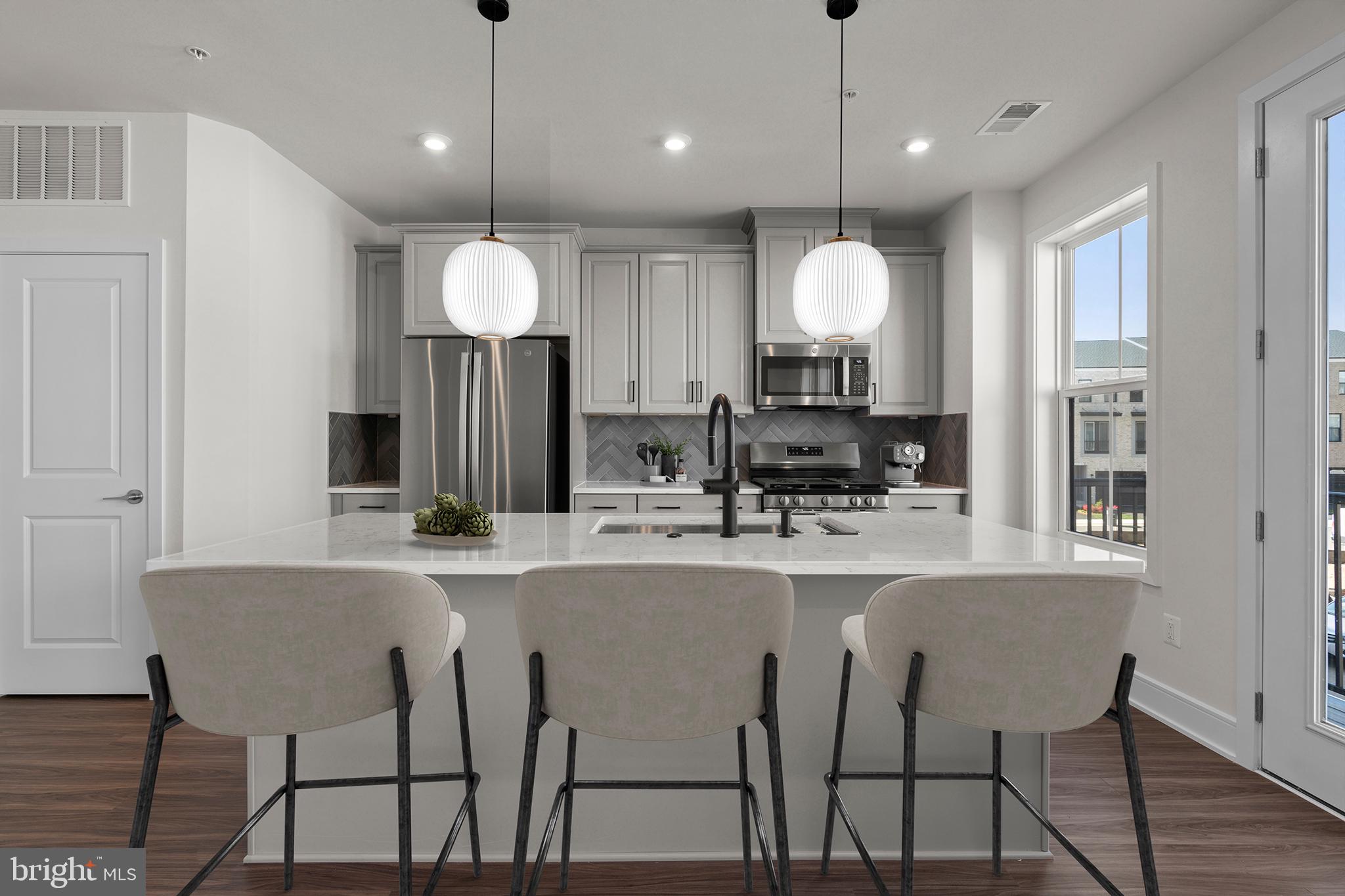 This brand-new incredible TOWNHOME-STYLE CONDOMINIUM by Van Metre Homes at DEMOTT & SILVER is available for you to call home NOW! Spanning 2,246 finished square feet across 4 levels, the CAMERON 24-R1-RT floorplan offers an unparalleled blend of sophistication and convenience. As you step inside, natural light floods the main level, illuminating the expansive great room and the elegant rear-set kitchen, complete with upgraded cabinets, tile backsplash, quartz countertops, and stainless-steel appliances. Upstairs, the lavish primary suite awaits, boasting a large walk-in closet and a spa-like 5-piece bathroom complete with double sinks, an attractive soaking tub, and an oversized, frameless shower enclosure with a built-in seat, a place to rejuvenate and prepare for the day's adventures or to unwind as evening falls. The top-level features two additional bedrooms and a full bathroom, while the lower level welcomes you with a gracious foyer and mudroom, providing seamless access to your one-car private garage. But that is not all! Picture yourself soaking in breathtaking sunsets and entertaining guests on the stunning roof terrace! This meticulously designed home combines the spaciousness of a townhome with the low-maintenance ease of condominium living. And being a new build, your home is constructed to the highest energy efficiency standards, comes with a post-settlement warranty, and has never been lived in before! This home is truly a must-see, promising comfort, style, and quality. Schedule your appointment today and make your dream home a reality! ----- Discover Demott & Silver, Van Metre’s exceptional community of townhomes and townhome-style condominiums nestled within the master-planned Broadlands community. This sought-after neighborhood offers unparalleled convenience with walking distance access to Metro’s Silver Line and the area’s most desirable amenities. Residents relish in a host of top-notch amenities across Broadlands, including a clubhouse, fitness center, three pools, tennis courts, vast green spaces, and extensive hiking and biking trails. With shopping, restaurants, Metro’s Ashburn Station, a bus stop, and nearby commuter routes at your fingertips, Demott & Silver is set to become the epitome of a superior community in Broadlands. ----- Take advantage of closing cost assistance by choosing Intercoastal Mortgage and Walker Title. ----- Other homes sites and delivery dates may be available. ----- Pricing, incentives, and homesite availability are subject to change. Photos are used for illustrative purposes only. For details, please consult a Community Experience Team.
