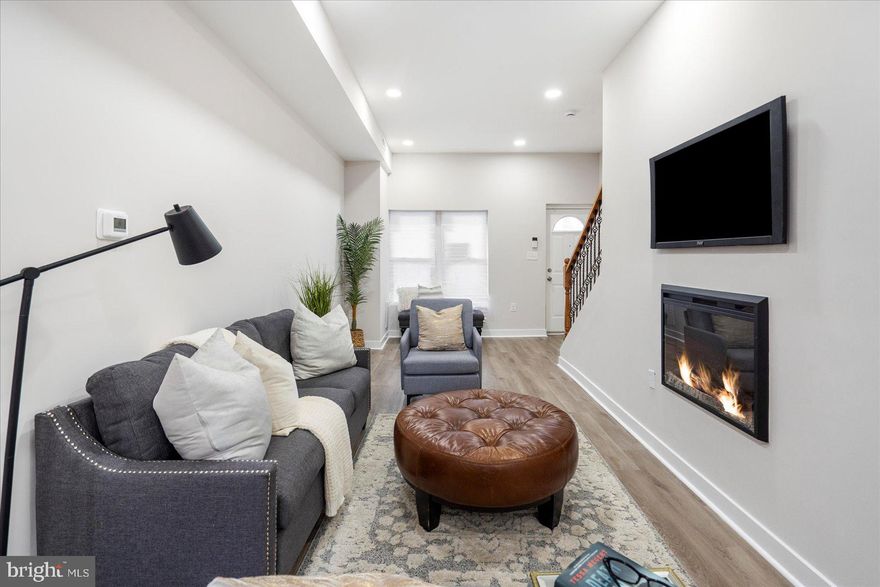 Welcome to 1731 N Bentalou Street — a fully renovated gem in the heart of Coppin Heights that delivers both modern style and incredible value. This beautifully reimagined rowhome blends Baltimore’s classic character with fresh, high-end finishes from top to bottom.
Step into the light-filled living room, where a sleek electric fireplace sets the mood and an open layout invites easy living. The designer kitchen is a true centerpiece, featuring upgraded countertops, a statement island, and space to gather, cook, and connect. The finished basement includes a brand-new full bathroom — perfect as a guest suite, private office, or cozy lounge.
Located just steps from Coppin State University and close to everyday essentials, this home is also grant-eligible, with tons of down payment assistance programs available. 
Why rent when you could own . Ask about the incentives and schedule your tour today — this one checks all the boxes and then some.