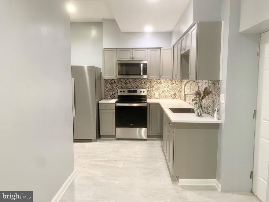 2 bedrooms, 2 bathroom apartment with a great location and TWO Private entrances.

Updated throughout, with a recently renovated master bathroom and kitchen with stainless steel appliances, dishwasher, garbage disposal,. Both bedrooms are large with plenty of closet space.

This unit features hardwood flooring throughout, central A/C and a small outdoor private space in the rear.

Centrally located, 1/2 a block from Broad and Ellsworth, the subway station, nearby Target, Starbucks, Sprouts and the brand new Giant! Available 4/15.