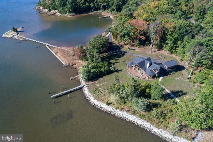 Serious sailor alert!  Magothy River 4.6 acre peninsula with 1700+ ft water frontage, deep water dock (10+ ft MLW) for 50-70' boat; small dock with 3+ft MLW and boardwalk to tiny island  plus approved pool site  -- a private paradise!  Beautifully built new 5500 SF home with first-floor master for one-level living.  Elegant 2 BR & 1 BA up & addit BR/BA w/sitting room just finished --MAGNIFICENT!