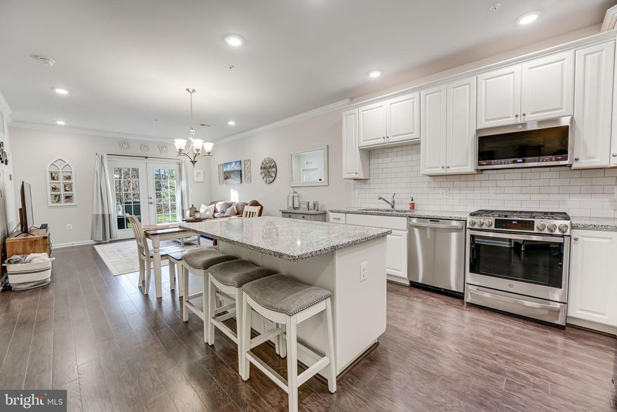 No steps -all main-level living!!  Plus an incredibly-low HOA/condo fee! Welcome to this charming 2-bedroom, 2-bathroom condo nestled in the heart of Ashburn, Virginia. This modern home, just four years young, boasts a contemporary and open design with no steps.    As you step into the inviting living space, you'll be greeted by an open floor plan that seamlessly connects the living, dining, and kitchen areas. The modern kitchen features white cabinetry, stainless steel appliances,  large center island perfect for gathering, modern tile backsplash & granite countertops making it a perfect setting for culinary enthusiasts.

The two spacious bedrooms offer comfort and tranquility, with the master bedroom featuring an en-suite bathroom for added convenience.  

Natural light floods the interior, enhancing the warmth and vibrancy of the living spaces. The condo also includes a private covered patio that backs to common area and trees, providing a serene outdoor retreat to unwind and enjoy the surrounding views.

The Ridges @ Loudoun Valley offers incredible amenities including three separate swimming pools, two fitness centers, tennis courts, tot lots and so much more!  

Located in Ashburn, this property offers proximity to a variety of amenities, including shopping centers, dining options, and recreational facilities. With no steps to navigate, this unit ensures easy living for individuals seeking a hassle-free lifestyle.   A short 9 minute drive to the Ashburn silver line metro station,  close proximity to the Greenway, Dulles International Airport, Rt 50 and more!  

Don't miss the opportunity to make this stylish and accessible condo your home. Schedule a viewing today and discover the comfort and convenience it has to offer.