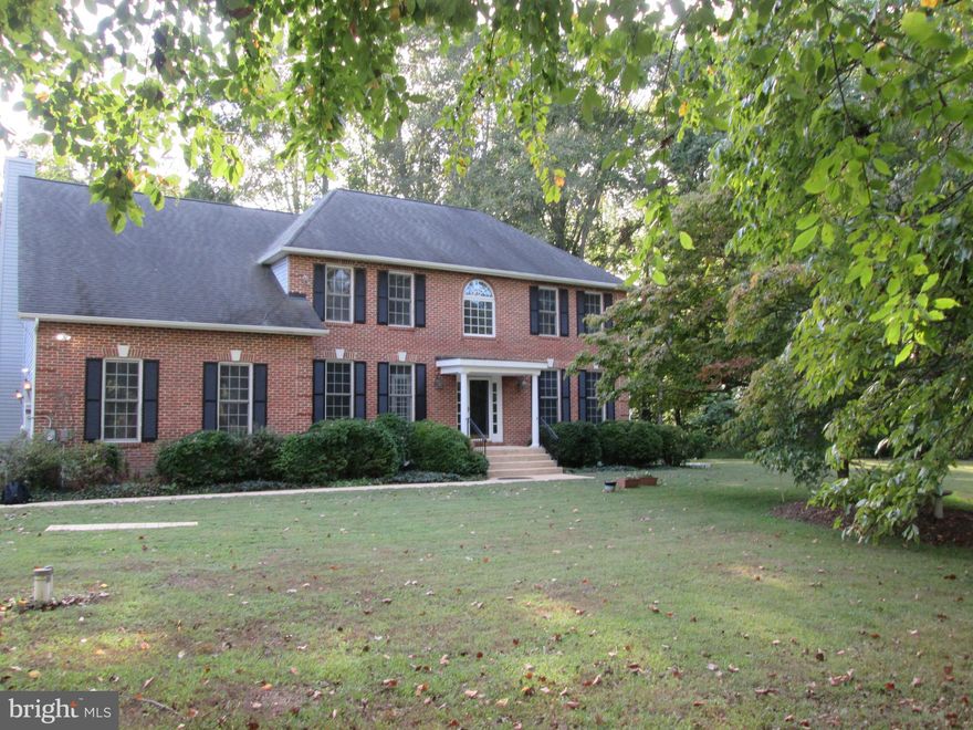 NO ELECTRIC BILLS  !!! AND CASH BACK FROM UTILTY !OVER 5000 SQ FOOT Home !!All on a 6.07 Acre Park Like Setting !! BRING YOUR HORSES !!40 x 32 Steel Building with Car Lift and 10 Foot Doors.   Lovely Colonial Home , Down a Country road !!All New Paint ,Carpet ,LPV Flooring , Ceiling Fans and Lighting ,4 Bedrooms and 3.5 Baths ,Enter to a 2 Story Foyer with Hardwood Floors with an Adjacent Study with French Doors. A Formal Livingroom and Dining room with Hardwood Floors and 9 Foot Ceilings. Large Kitchen with 42inch Cabinets ,Double Wall Ovens ,Stainless Steel Appliances ,Island and New LPV Floors, Bright and Airy Morning room off the Kitchen and Large Family room with Brick Fireplace with New LPV Floors . Private rear Screened Porch for relaxing and entertaining, with Pastoral views. Large Master Suite with Sitting room, Master Bathroom with Soaker Tub ,Double Vanity and New Custom Tiled Separate walk in  Shower. Large Walkout Basement with Full Bath rough in and Kitchen rough in .Water Softener and Filter and Wood Stove. Solar Panels that pays all Electric !!  EV Charger in Garage conveys. This is an Amazing Property !! Horse and ATV Trails !! Grape Vines, Black Berries, Figs and Fruit bearing Paw Paw Trees, Dog Woods and Oaks. A Wonderful Home and Property !! Close to Schools ,Shopping ,Restaurants ,5+ wineries, many State Parks including Patuxent River Park, Jug Bay Natural Area, Watkins Regional  and Rosaryville!!
Great Commute to Washington DC, Joint Base Andrews, Fort Meade, NSA ,Baltimore and Annapolis.