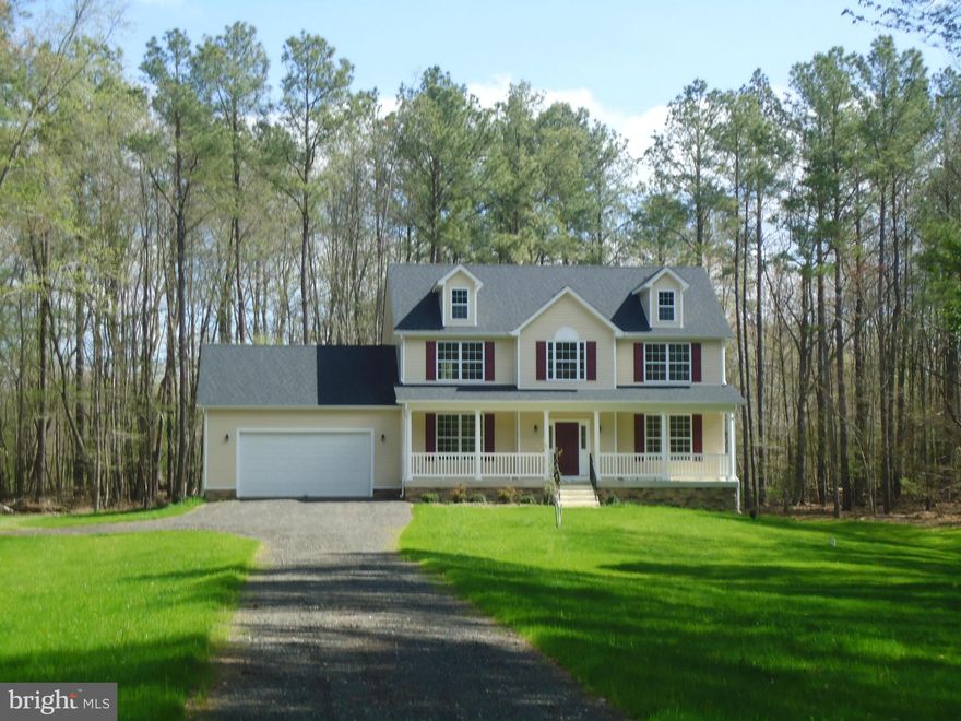 Beautiful wooded 15 acre farmstead with brand new home.  Spacious home with room to expand in unfinished basement.  Maple cabinets, granite counters, SS appliances, nice hardwood flooring, fireplace in family room.  French glass doors lead to library or formal living room.  Wood shelves in all closets.   Enjoy spacious back deck, front porch and large finished garage with automatic openers.