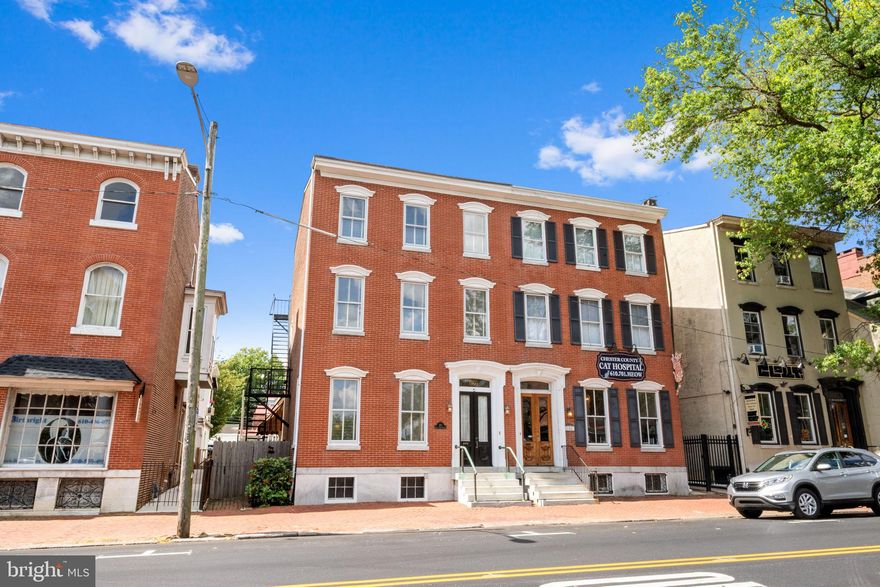 It doesn't get any better than this! Welcome to this Turn-Key Classic Brick, Two-Unit, Three Story Property in the Heart of Downtown West Chester Borough. Professionally updated and upgraded by Hazley Builders, this historic building recently underwent an extensive renovation in 2021. Tastefully updated while retaining its original character and charm this property is located in Town Center and offers high visibility with multiple use cases. The First Floor features a beautiful Unit complete with Full Kitchen, Tiled Bath with Walk-In Zero-Entry shower, Laundry and Bedroom. The Second Floor Unit Features a Unique Open Floor Plan with Oversized Combination Kitchen/Great Room, Bosch Appliances, Custom Cabinetry, Soapstone Countertops and an Extra-Large Island make entertaining a dream! The Second Floor also features a large Master Bedroom with Walk-In Closet and a Tiled Full Hall Bath. The Third Floor offers an additional two Bedrooms sharing a Marble-Tiled Bath and Hall Laundry. Outside you’ll find a 2 Car Garage with 4 additional parking spaces, a meticulously manicured fenced rear yard and patio with second floor private rear deck, all rare to find in Downtown West Chester. New Electrical, New Plumbing, New HVAC, Gorgeous Hardwood Floors and Ample Storage make this home unlike anything else you'll find in the Borough and needs nothing but your personal touches! Don’t miss out on this opportunity!