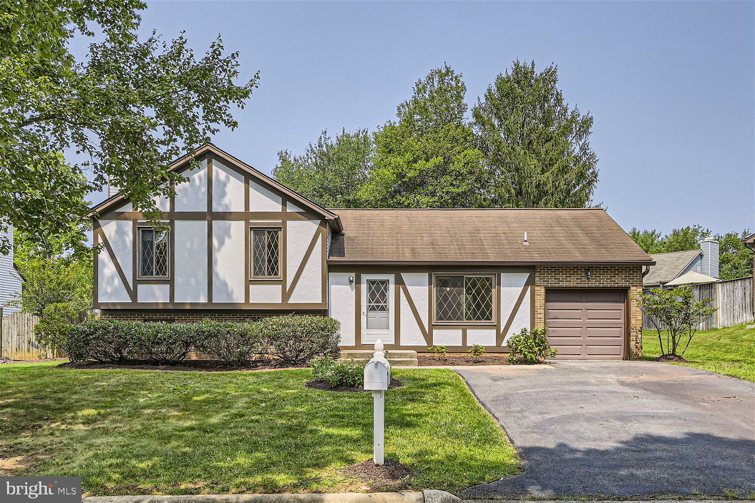 Stately 4BR/3BA split level located on a quiet tree-lined street in Germantown. Walk past a lush green lawn and landscaping on your way to the front door of your forever home. Step inside to beautiful LVP flooring throughout the three floors of living. The main floor offers an eat-in kitchen beaming with natural light, access to the one-car garage, and an open concept living/dining room with sliding doors to the yard. The second floor boasts two sizable secondary bedrooms, a full bath, and a large primary bedroom featuring a private bath. The lower level is finished with above grade windows in the large den, the fourth bedroom, a full bath with walk in shower, laundry, and storage. From the sliding doors in the dining room, step outside to a yard filled with tons of green space, adult trees and tons of possibilities. This home has so much to offer new homeowners and is in close proximity to shopping, restaurants, and commuter routes.
