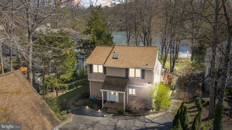 Start your summer on the lake!  Welcome to this exceptional 5-bedroom, 3 full bathroom lakefront retreat, perfectly situated on the main lake and offering a true compound-style layout with a separate guesthouse — also the homes come furnished plus a boat for immediate enjoyment.  The main residence features a spacious and thoughtfully designed layout, including a main-level bedroom suite with a beautifully appointed bathroom and tiled shower. The great room impresses with soaring ceilings and a cozy fireplace, creating an open and inviting atmosphere. The kitchen is both stylish and functional, showcasing granite countertops, ample cabinetry, and flows seamlessly into the great room.   Upstairs, you’ll find two additional bedrooms and a full bathroom, providing plenty of space for guests or family, plus there is an extra enclosed storage area. Hardwood flooring runs throughout most of the main level, complemented by tile flooring in the kitchen for added character and durability.    To the back of the main house is a large dining area that extends into a comfortable sitting room with a second fireplace, ideal for entertaining or relaxing with family.   The guesthouse offers excellent flexibility, featuring new LVP flooring on the main level, its own kitchen and living area, and direct access to the garage (where the boat trailer is currently stored). Upstairs includes two additional bedrooms, making it perfect for visitors or family.   Outdoor living is where this property truly shines. Situated directly on the main lake, the private dock has been recently upgraded with low-maintenance composite decking and includes a motorized boat lift, making lake life effortless and enjoyable.  Large backyard with two tier deck perfect for outdoor dining and relaxing. This is a rare opportunity to own a fully equipped, multi-generational lakefront property — just in time for summer.  Lake of the Woods is an amenity rich, gated community with 24-hour security, 2 lakes, 9 beaches, equestrian center, fitness center sports fields/parks and it even has its own fire dept.  Located within close proximity  to Fredericksburg City.  Schedule a tour today and see what lake life is all about!