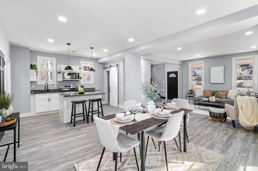 Welcome to 5810 Gwynn Oak! This turn-key home features 4 bedrooms and 3.5 bathrooms. Upon entering, you're greeted by an expansive living space, 9 ft ceilings, open floor plan, recessed lighting, new LVP flooring, and fresh paint. The living room is well lit with natural light from the large windows, enhancing the inviting and comfortable atmosphere and flows seamlessly into the dining area and newly renovated, modern kitchen with high end features like granite counters, a spacious island, and new stainless-steel appliances. Just off the kitchen, there is a covered back porch, perfect for enjoying your morning coffee. Upstairs, discover 3 bedrooms; all bedrooms boast tall ceilings. The primary bedroom features an en-suite bathroom. The upstairs hall bathroom offers modern and luxurious finishes. The fully finished lower level is perfect for a family room, guest space, home gym, or a separate space to rent out with its own entrance and also offers an additional spacious bedroom and fully updated en-suite bathroom. Outside you can enjoy the expansive front porch. Convenient commuter routes to I-70, 26 and 695.