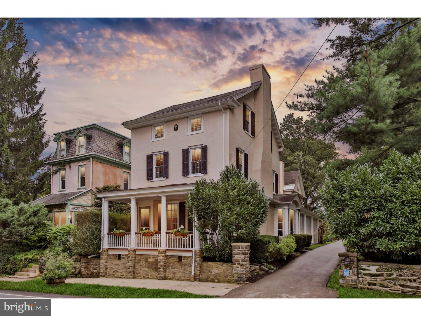 Move in together! This extremely rare property in coveted West Mt. Airy features a 5 BR/ 3.5 Bath historic farmhouse AND a fully renovated 2 BR/1 Bath carriage house on the same enchanting land. This beautiful compound has been used for multi-generational living for over 100 years, bringing grandparents and grandchildren closer, and allowing families to share companionship, meals, childcare, and many aspects of life.    While situated in the heart of Mt. Airy?walking distance to trains, Fairmount Park trails, and Germantown Avenue?this property feels like a tranquil country oasis as soon as you enter the driveway. The city drops away as you are enfolded in the greenery of stately mature trees, pollinator-certified flower gardens, lawns with patios, and landscaped shrub beds.   The main house has been meticulously restored to a breathtaking blend of old character and new amenities. This house is open and sun-lit with refinished hardwood floors throughout, providing beauty as well as unparalleled functionality, perfect for the modern family.   Through a covered front entry, you enter the original 1850's era farmhouse;  a formal living room with an art-deco mantle, large windows, and generous built-in bookshelves greets you.  Adjacent are a generous dining room for entertaining and a window- enclosed sunroom perfect for soaking up sun on winter days.   Butlers pantry with capacious built-in, but also  wet bar, beverage fridge and granite countertops is great for hosting. Kitchen is large enough to eat-in, fully renovated with stainless appliances,  granite countertops, Smeg chef's range, radiant flooring, and nearby washer/dryer for maximum efficiency.  Adjacent are a powder room and rear-entry mud room.  Upstairs in the main house features private living spaces with generous bedrooms and updated bathrooms that offer the option of a master dressing room and home office.   The stately carriage house can be entered via a patio deck overlooking the grounds. A charming exposed-beam living room greets you. The carriage house contains a modern galley kitchen with a pass-through counter to a dining room, two additional bedrooms and renovated bath with shower/ tub.  The structure also contains a spacious 3-car garage with electric-car hookup and additional storage rooms downstairs. Both buildings have been  recently re-wired and re-plumbed and are in excellent shape.   The carriage house apartment could also be used to house an au pair or nanny,  as a home office or
